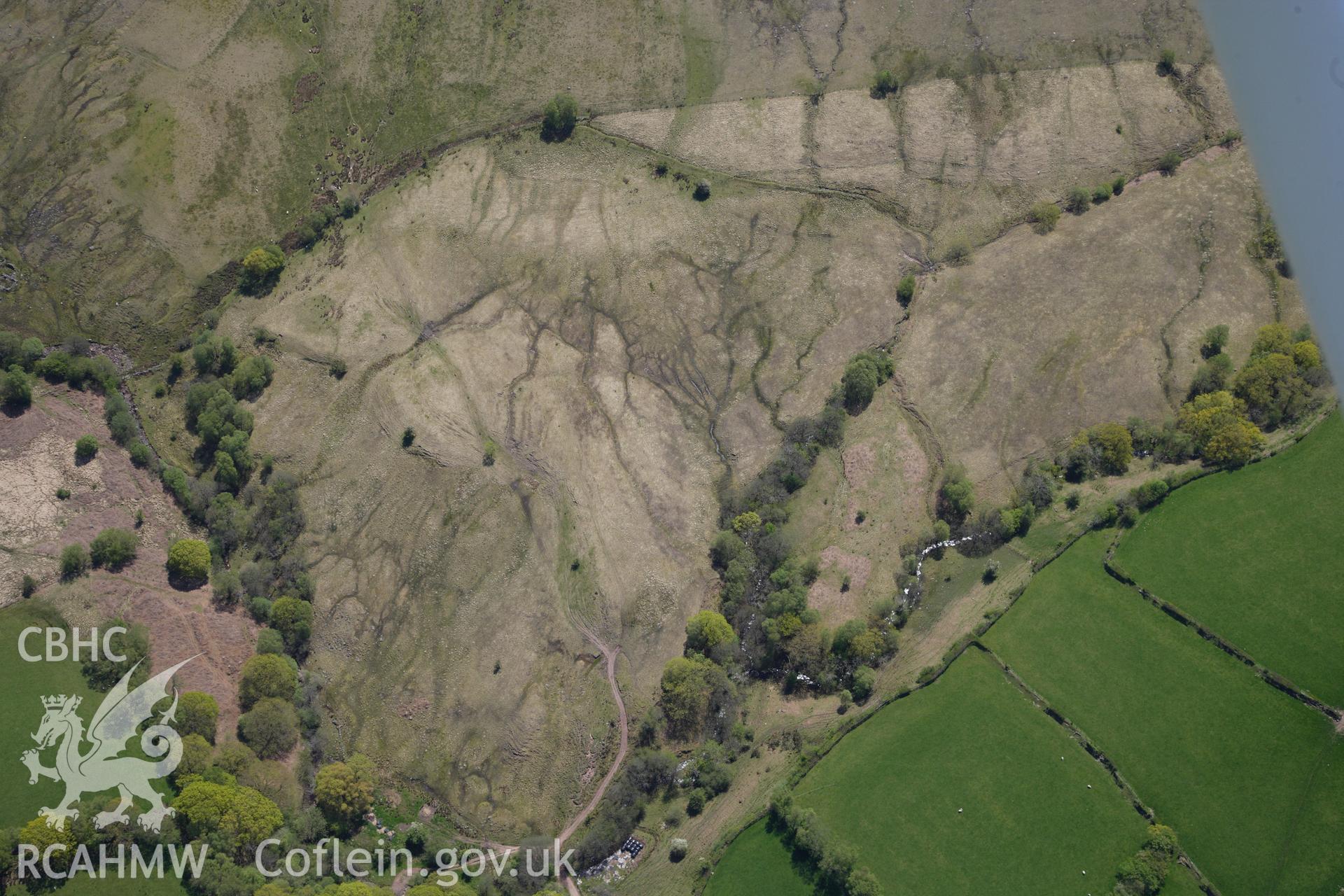 RCAHMW colour oblique photograph of Llwyn Wennol, burnt mound, and wider landscape, from north. Taken by Toby Driver on 22/05/2012.