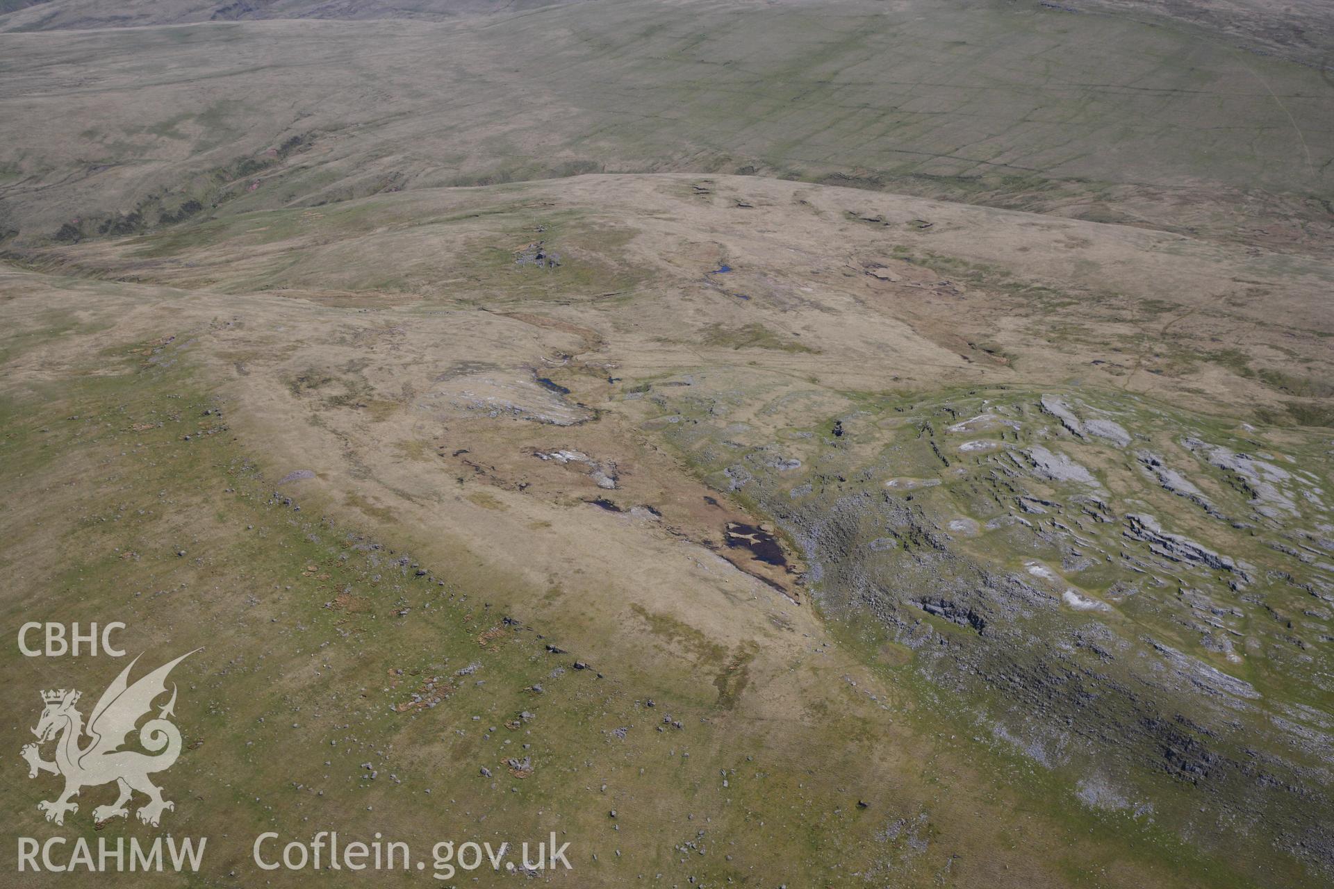 RCAHMW colour oblique photograph of Carn y Gigfran, cairn, in landscape. Taken by Toby Driver on 22/05/2012.