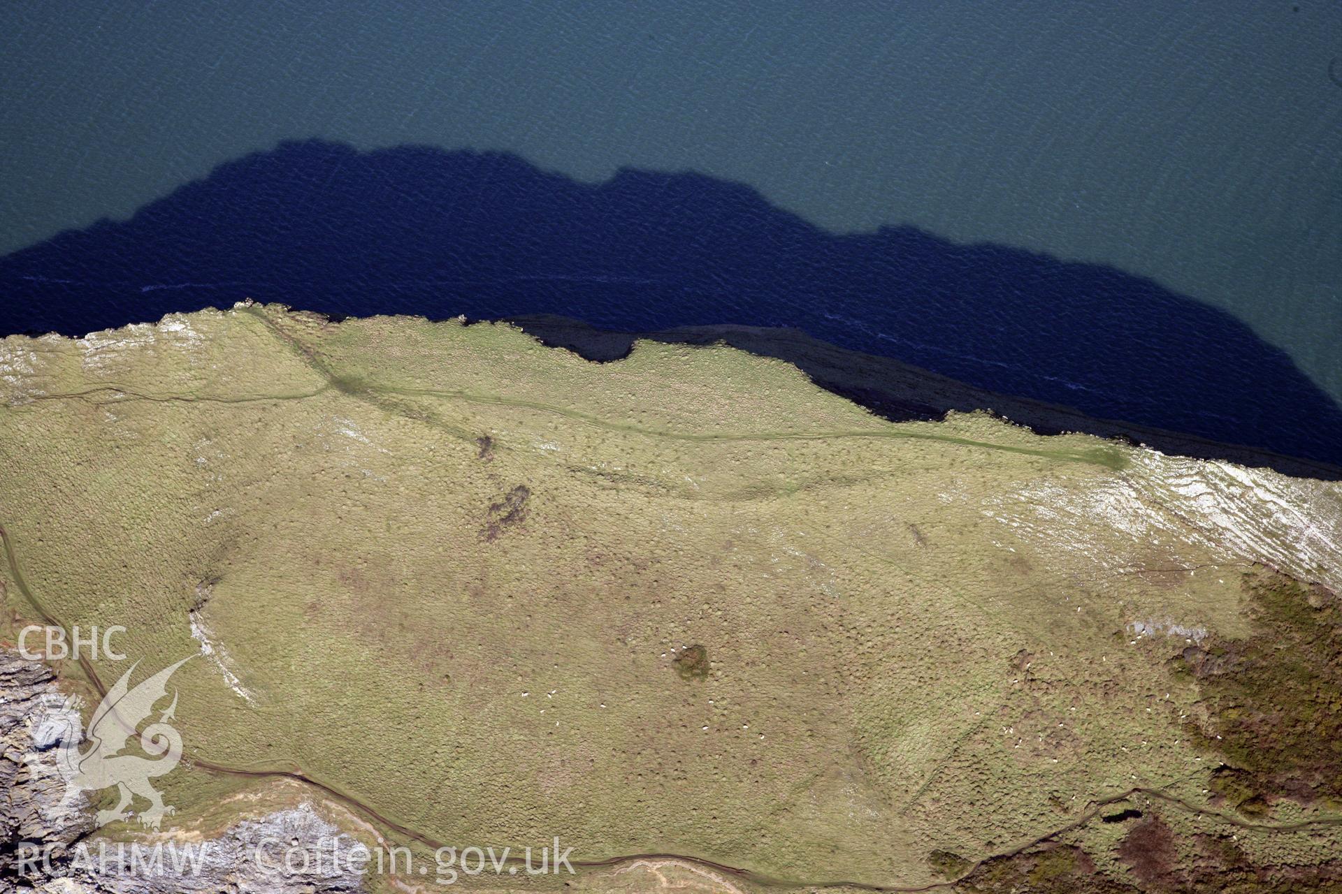 RCAHMW colour oblique photograph of Worms Head Camp. Taken by Toby Driver on 02/02/2012.