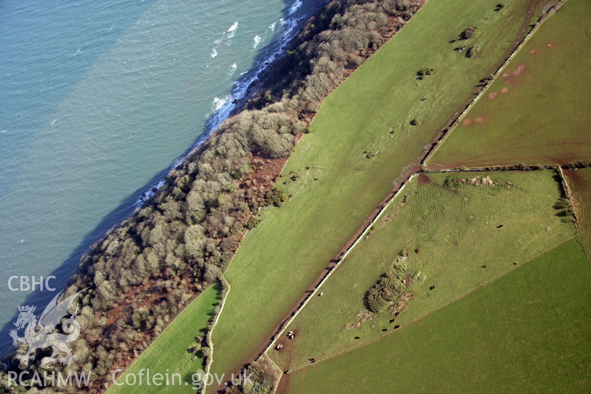 RCAHMW colour oblique photograph of S-E of St Illtud's Church, Oxwich. Taken by Toby Driver on 02/02/2012.