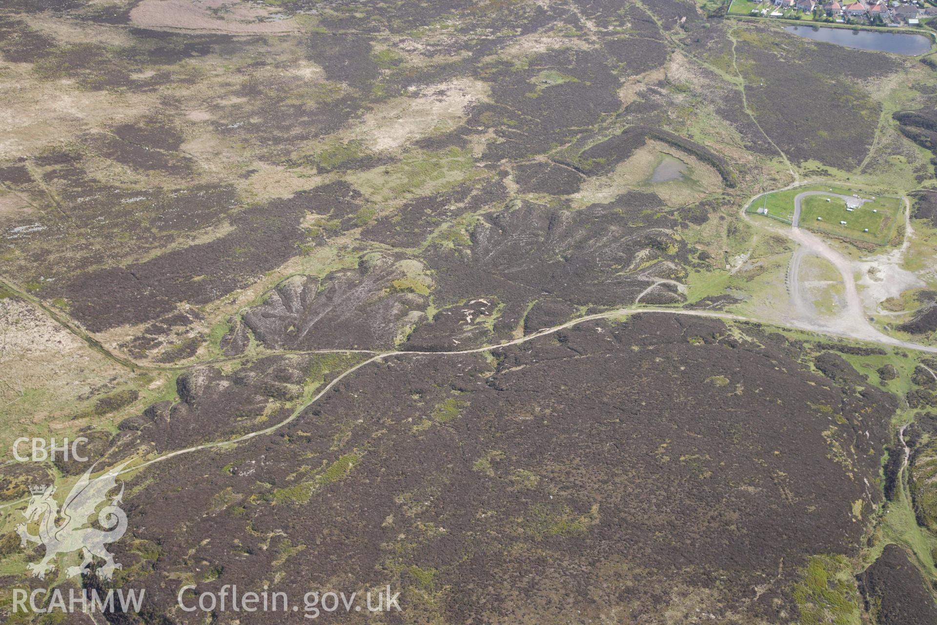 RCAHMW colour oblique photograph of Pen-ffordd-goch iron and coal workings and patching. Taken by Toby Driver on 22/05/2012.