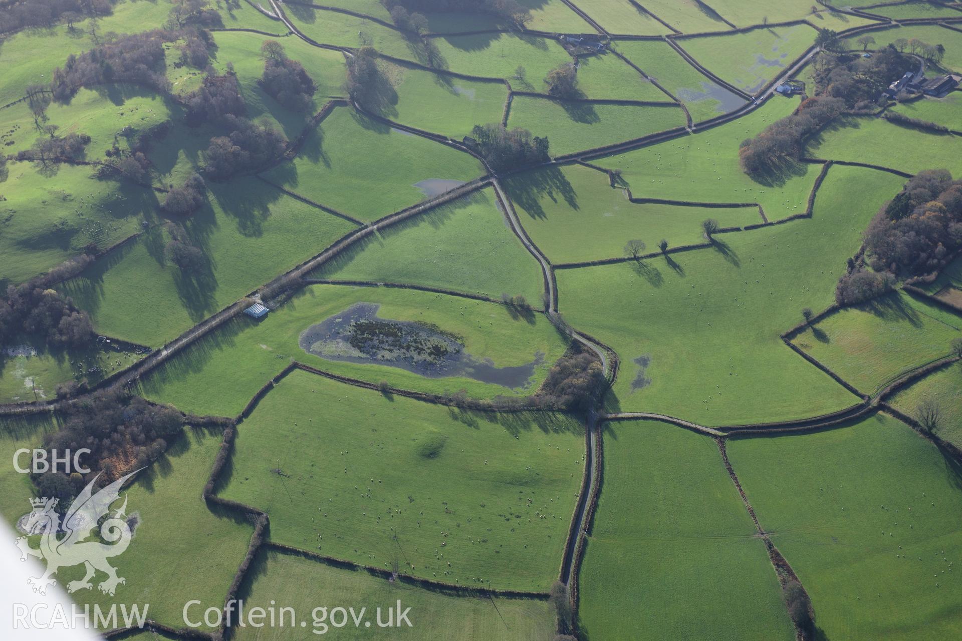 RCAHMW colour oblique photograph of Waun Pwtlyn, long barrow or natural mound. Taken by Toby Driver on 23/11/2012.