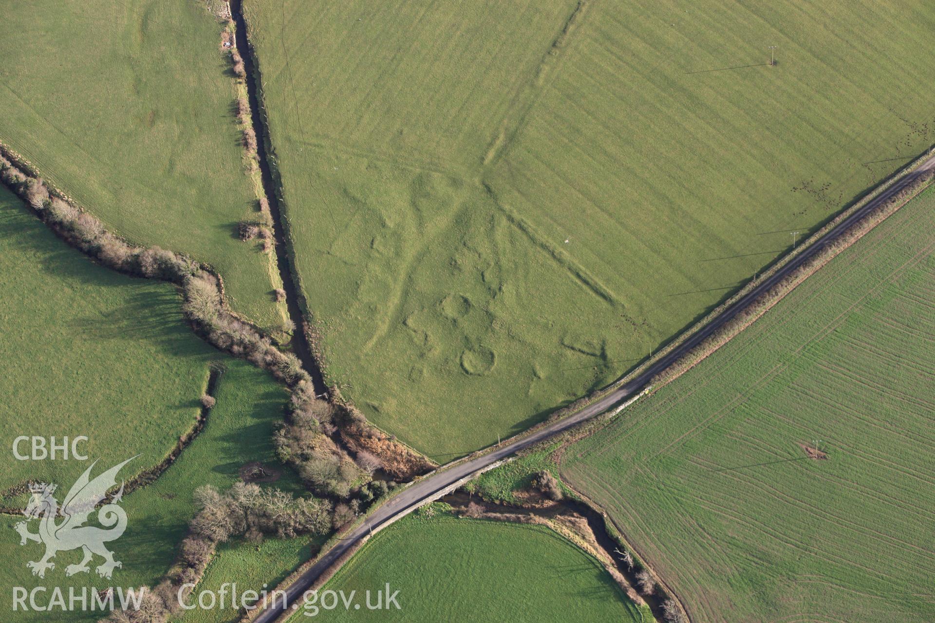 RCAHMW colour oblique photograph of Pont Sarn-las hut group, showing in low light. Taken by Toby Driver on 13/01/2012.