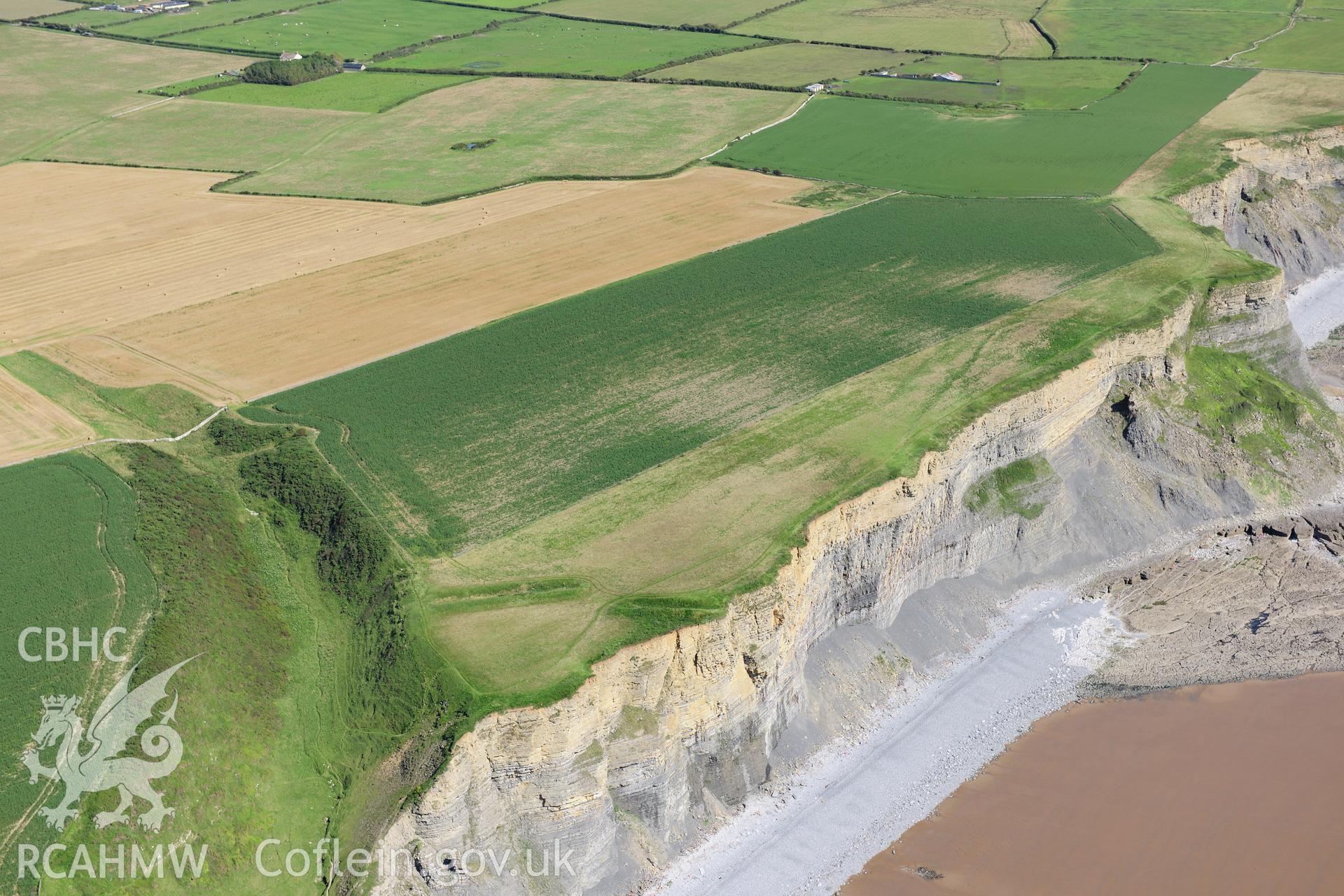 RCAHMW colour oblique photograph of Cwm Bach Camps, with cliff erosion. Taken by Toby Driver on 24/07/2012.