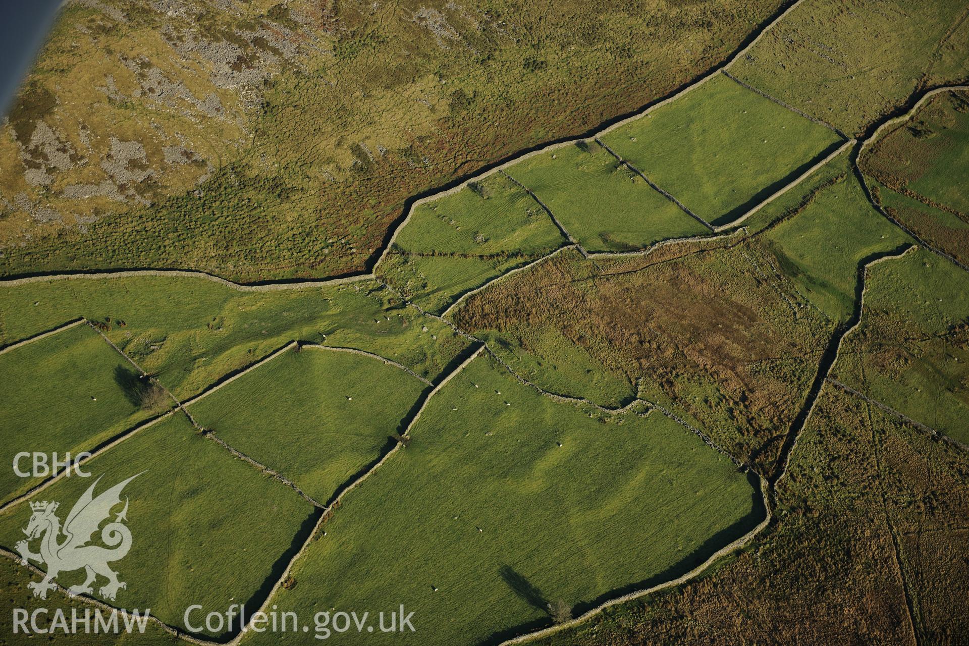 RCAHMW colour oblique photograph of Tyddyn mawr settlement and field system. Taken by Toby Driver on 10/12/2012.