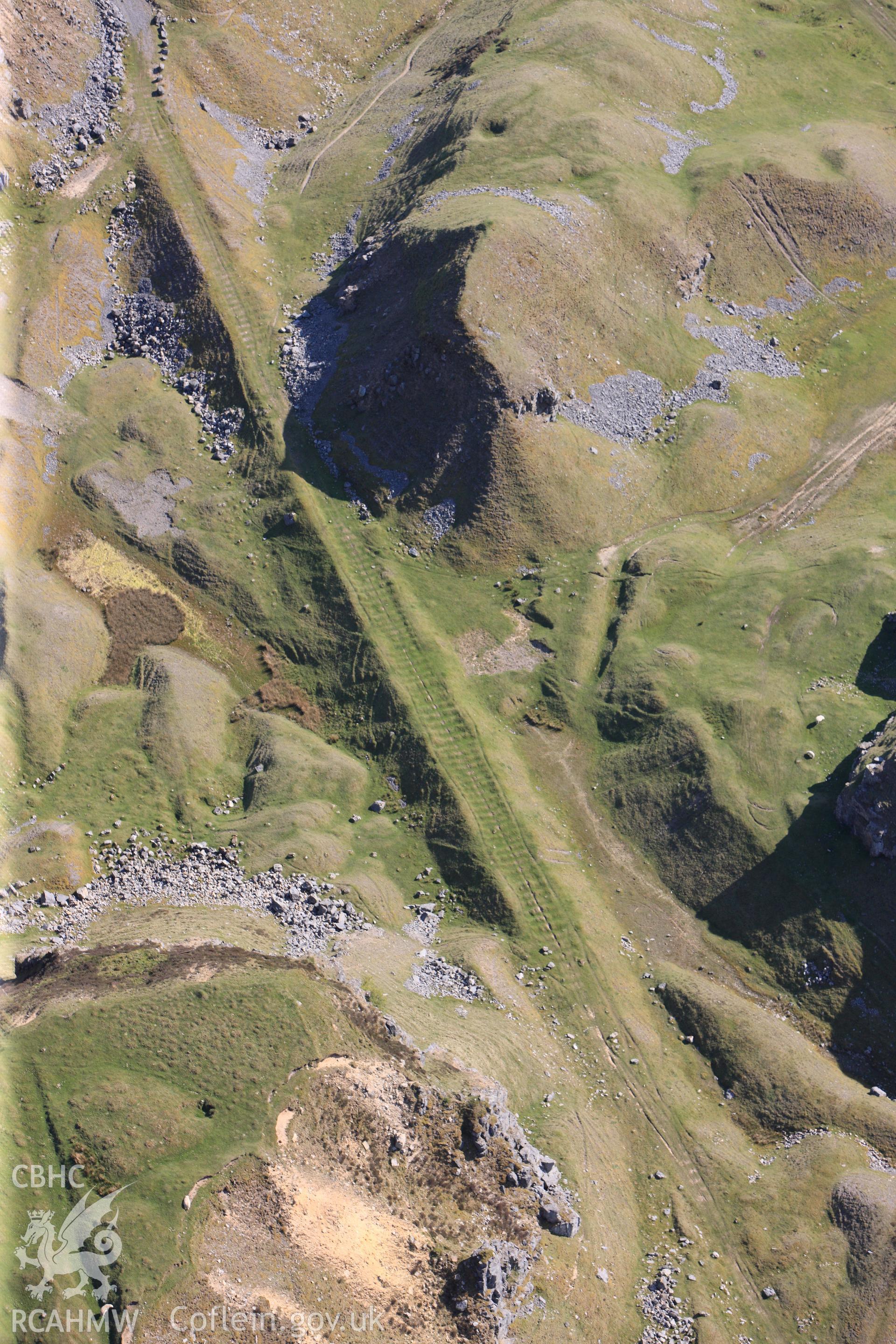 RCAHMW colour oblique photograph of Trefil Quarry, parchmarks of stone sleepers on tramroad. Taken by Toby Driver on 22/05/2012.