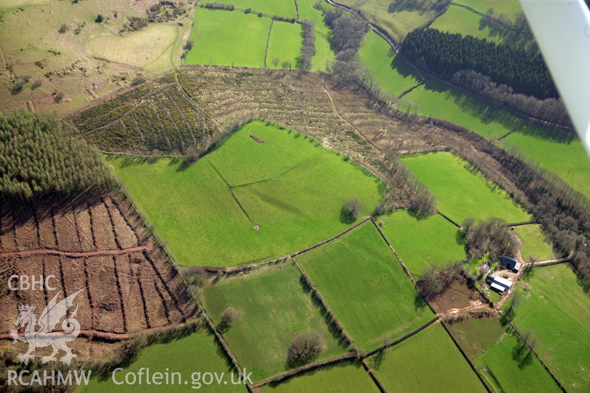 RCAHMW colour oblique photograph of Penpont-fach, denuded hillfort west of Twyn y Gaer hillfort. Taken by Toby Driver and Oliver Davies on 28/03/2012.