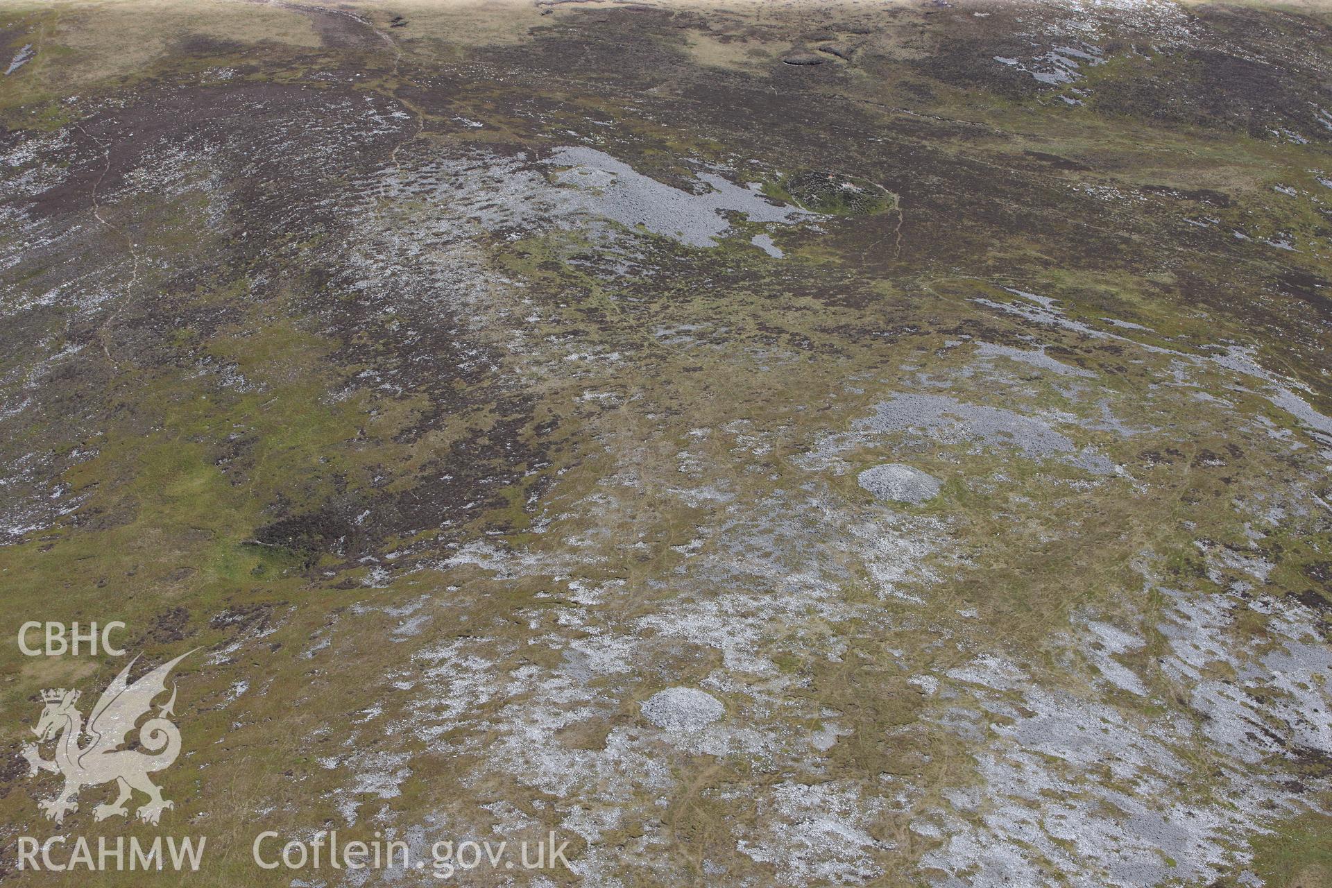 RCAHMW colour oblique photograph of Tair Carn Uchaf cairns, view from the west. Taken by Toby Driver on 22/05/2012.