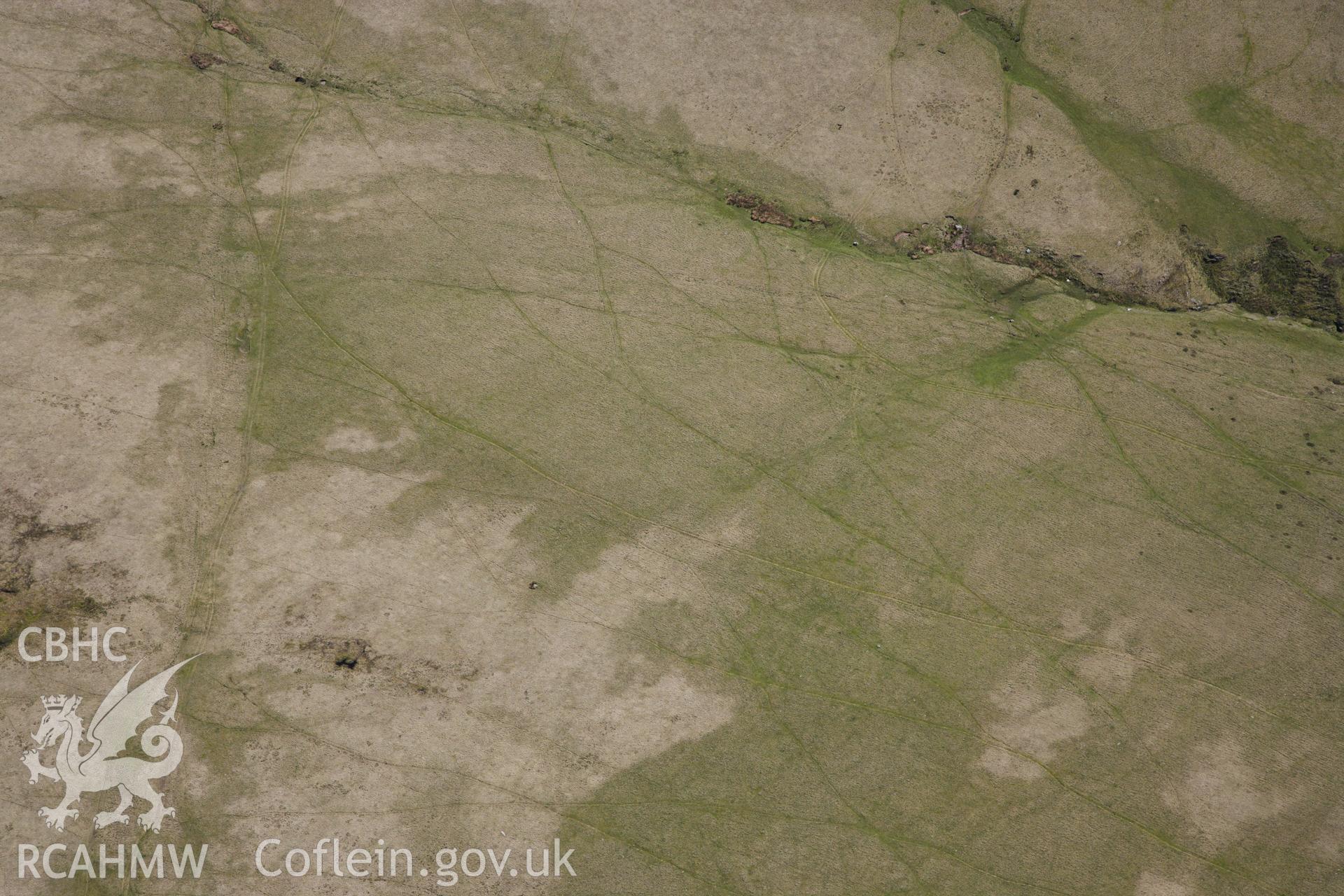 RCAHMW colour oblique photograph of Bannau sir gaer stone circle, possible missed target. Taken by Toby Driver on 22/05/2012.