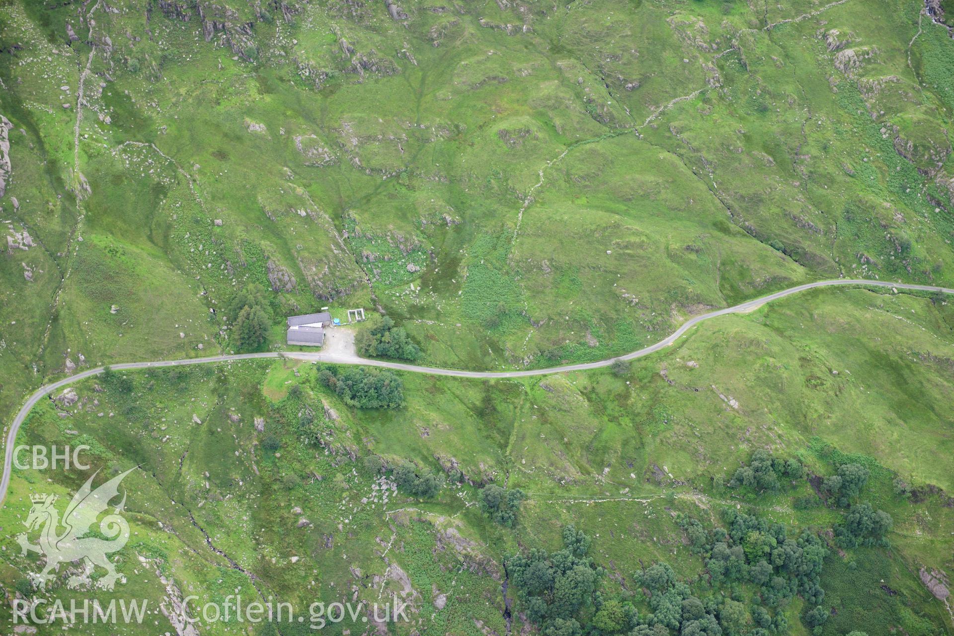 RCAHMW colour oblique photograph of Yr Hafod, fold and mortar emplacement, Nant Ffrancon anti-invasion defences, viewed from the north-east. Landscape view. Taken by Toby Driver on 10/08/2012.