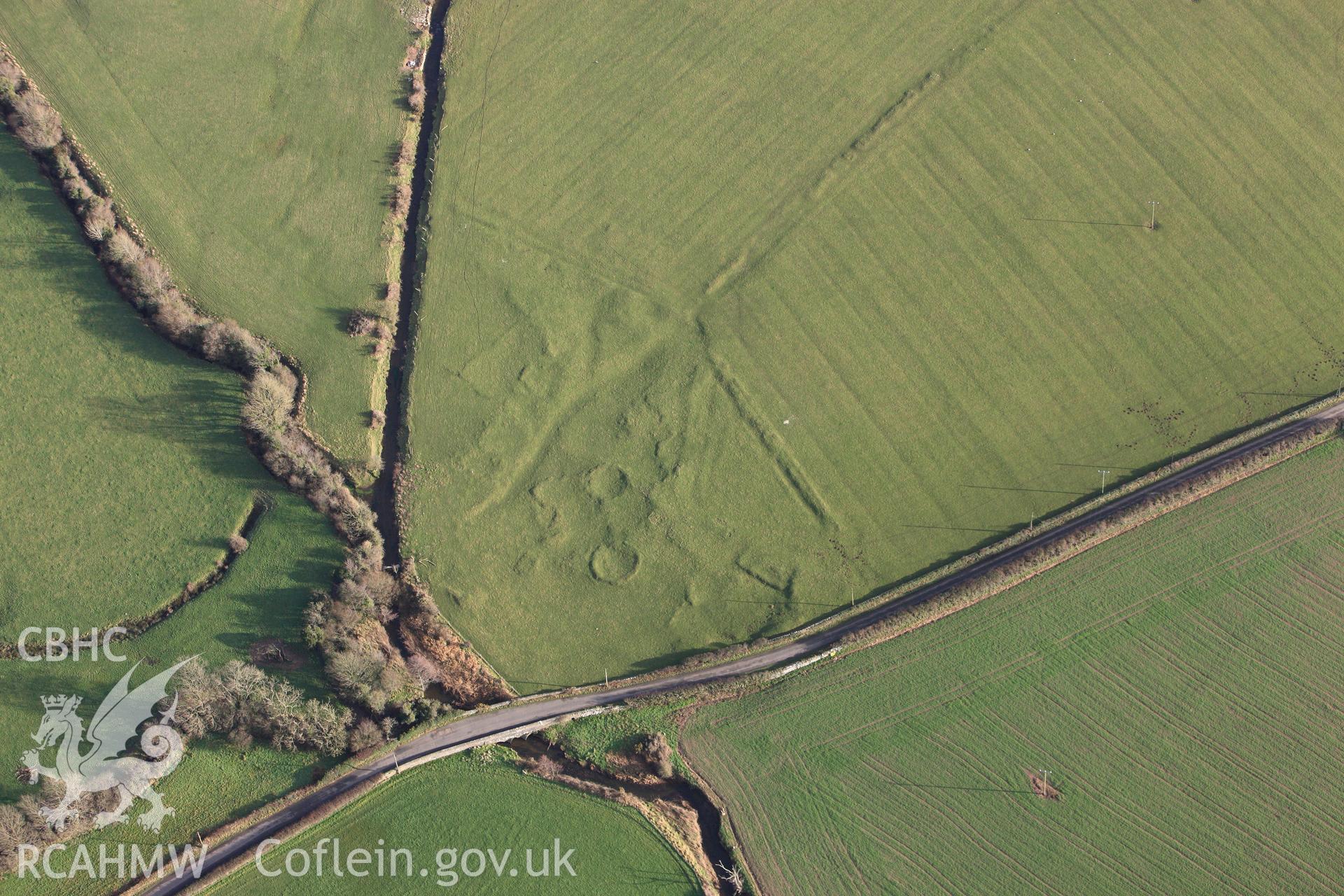 RCAHMW colour oblique photograph of Pont Sarn-las hut group, showing in low light. Taken by Toby Driver on 13/01/2012.