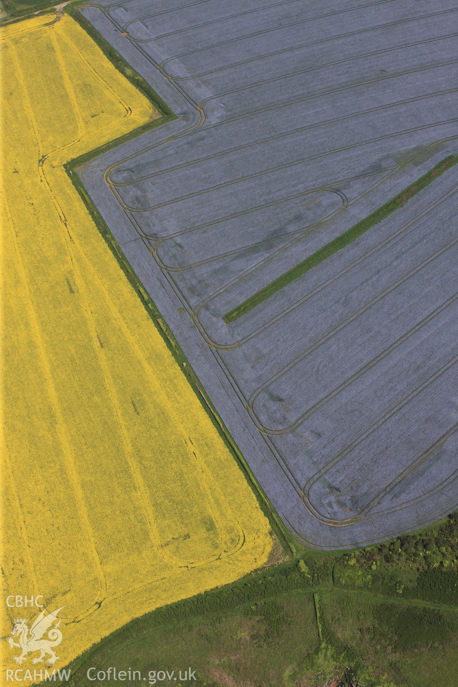 RCAHMW colour oblique photograph of General view of fields looking north towards St Ishmael's parish church. Taken by Toby Driver on 24/05/2012.