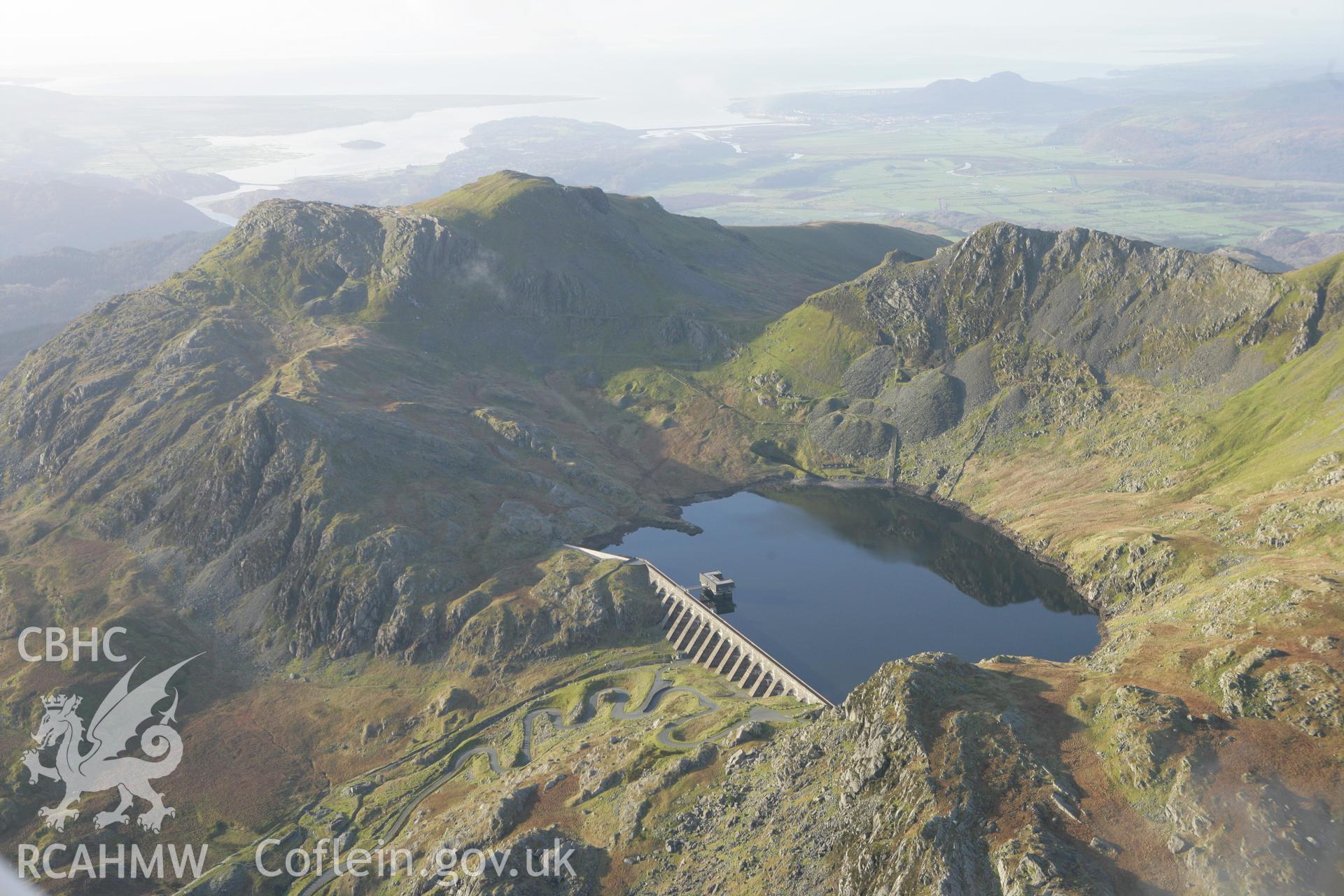 RCAHMW colour oblique photograph of Llyn Stwlan reservoir, with Moelwyn slate quarry. Taken by Toby Driver on 13/01/2012.