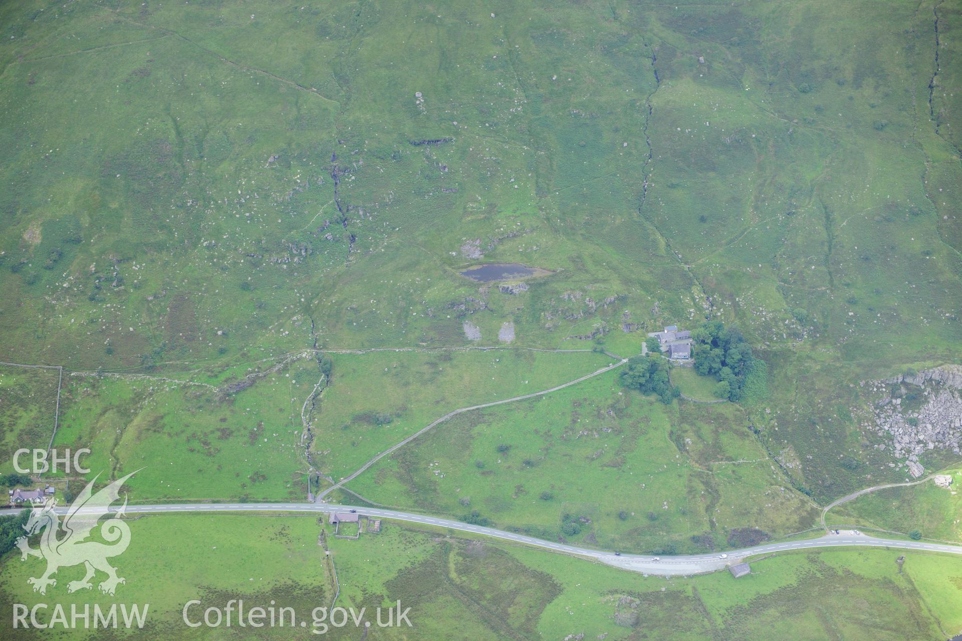 RCAHMW colour oblique photograph of cottages, cow sheds, enclosure, old house and new house, Dyffryn Mymbyr, viewed from the west. Taken by Toby Driver on 10/08/2012.