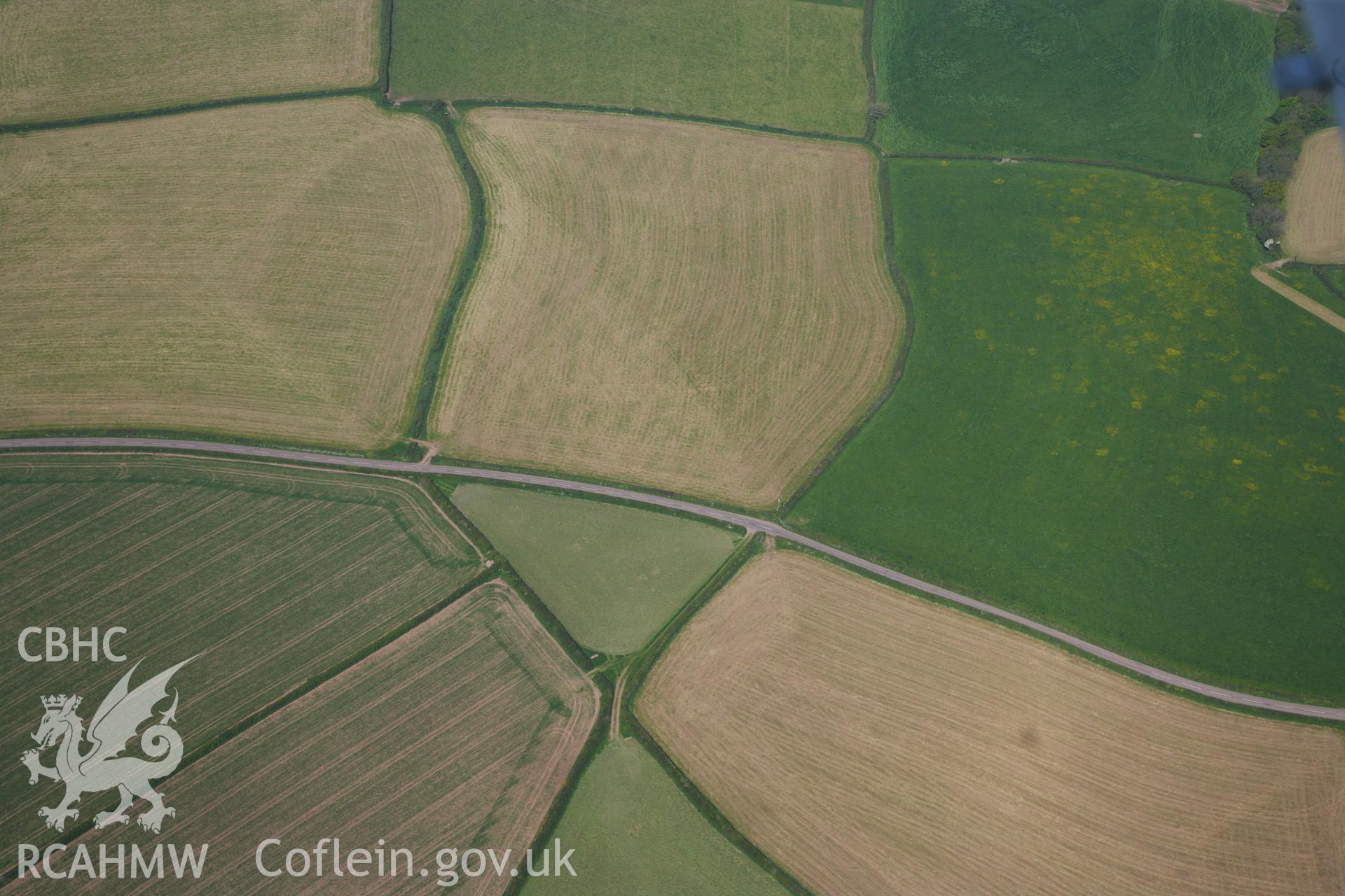 RCAHMW colour oblique photograph of General view of Pen-yr-Heol round barrow, looking north west. Taken by Toby Driver on 24/05/2012.