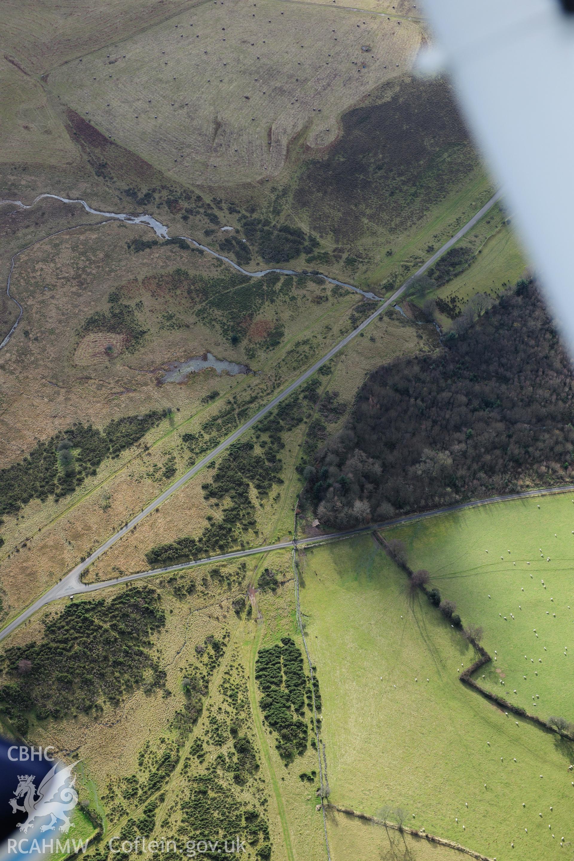 RCAHMW colour oblique photograph of Roman road on Mynydd Illtyd, course of road at junction. Taken by Toby Driver on 28/11/2012.