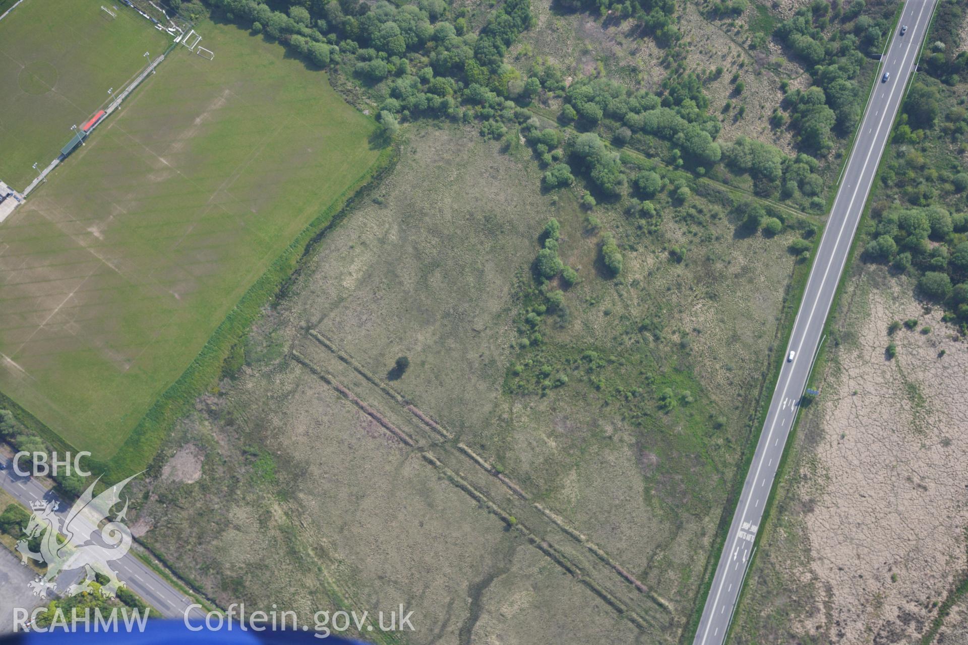 RCAHMW colour oblique photograph of Close view of Roman military enclosure on Stafford Common, looking north east. Taken by Toby Driver on 24/05/2012.