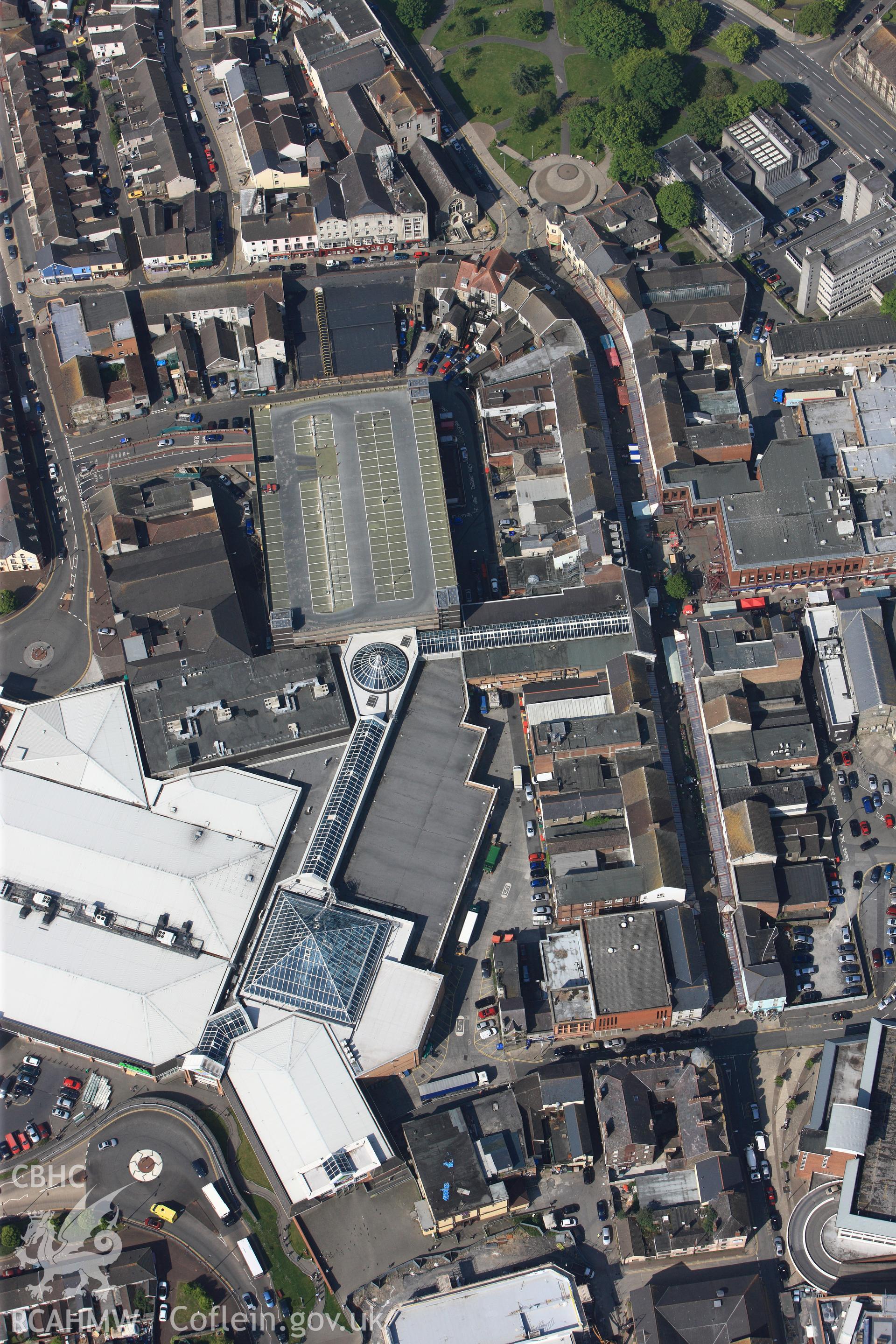 RCAHMW colour oblique photograph of General view of St Elli shopping centre, looking west. Taken by Toby Driver on 24/05/2012.