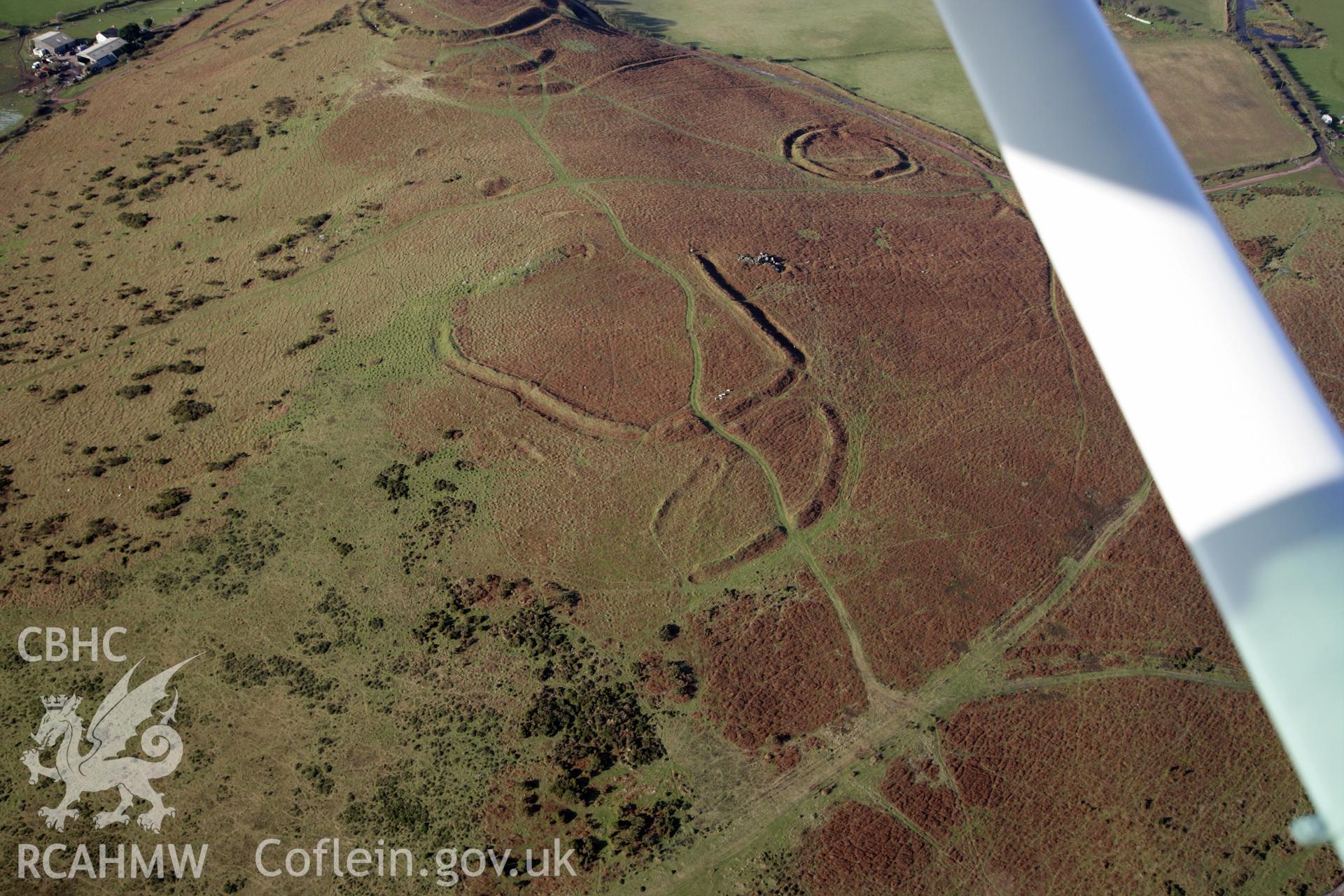 RCAHMW colour oblique photograph of Three Camps On Hardings Down. Taken by Toby Driver on 02/02/2012.