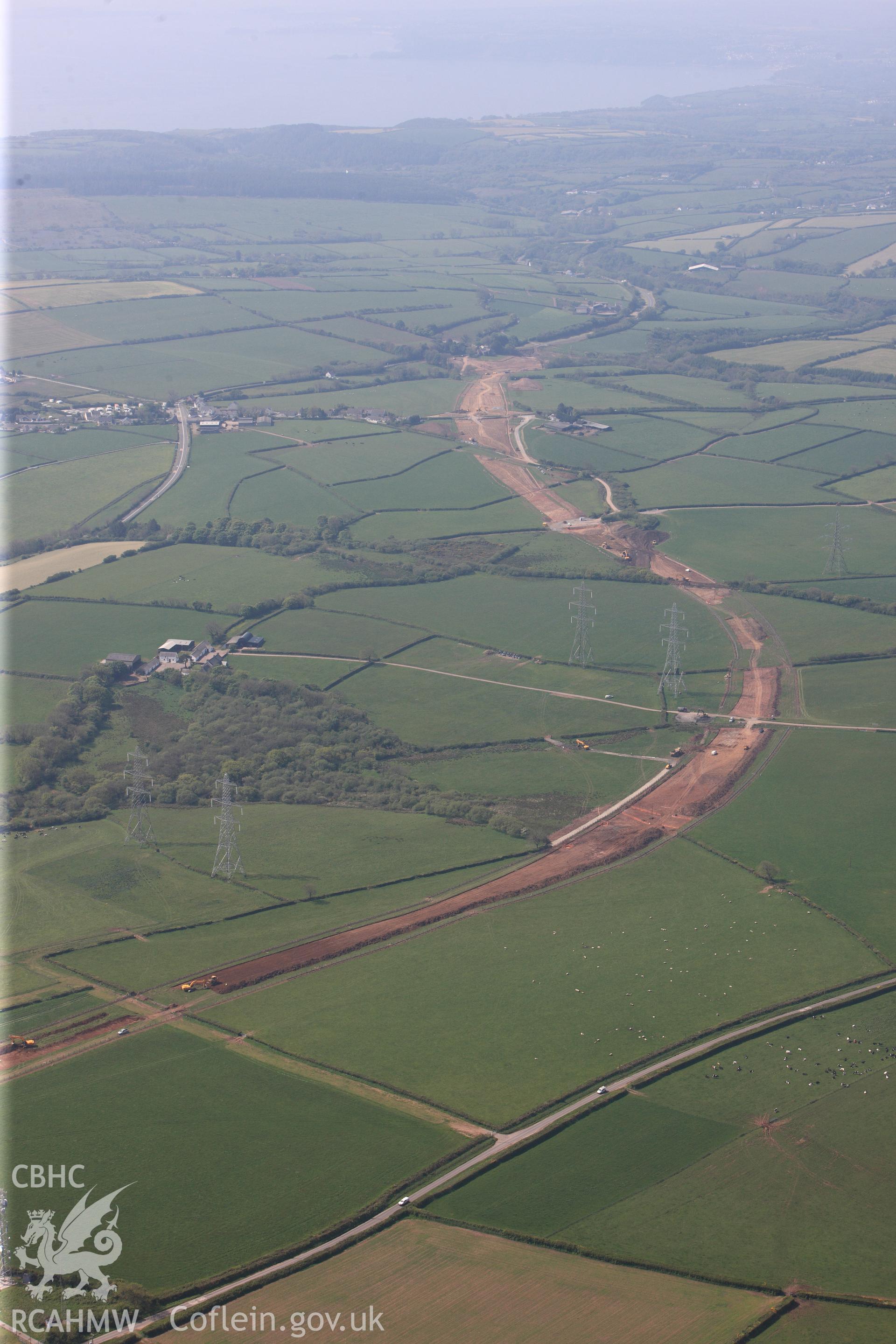 RCAHMW colour oblique photograph of General view of construction of new bypass to Pembroke Dock, looking south west towards Red Roses. Taken by Toby Driver on 24/05/2012.