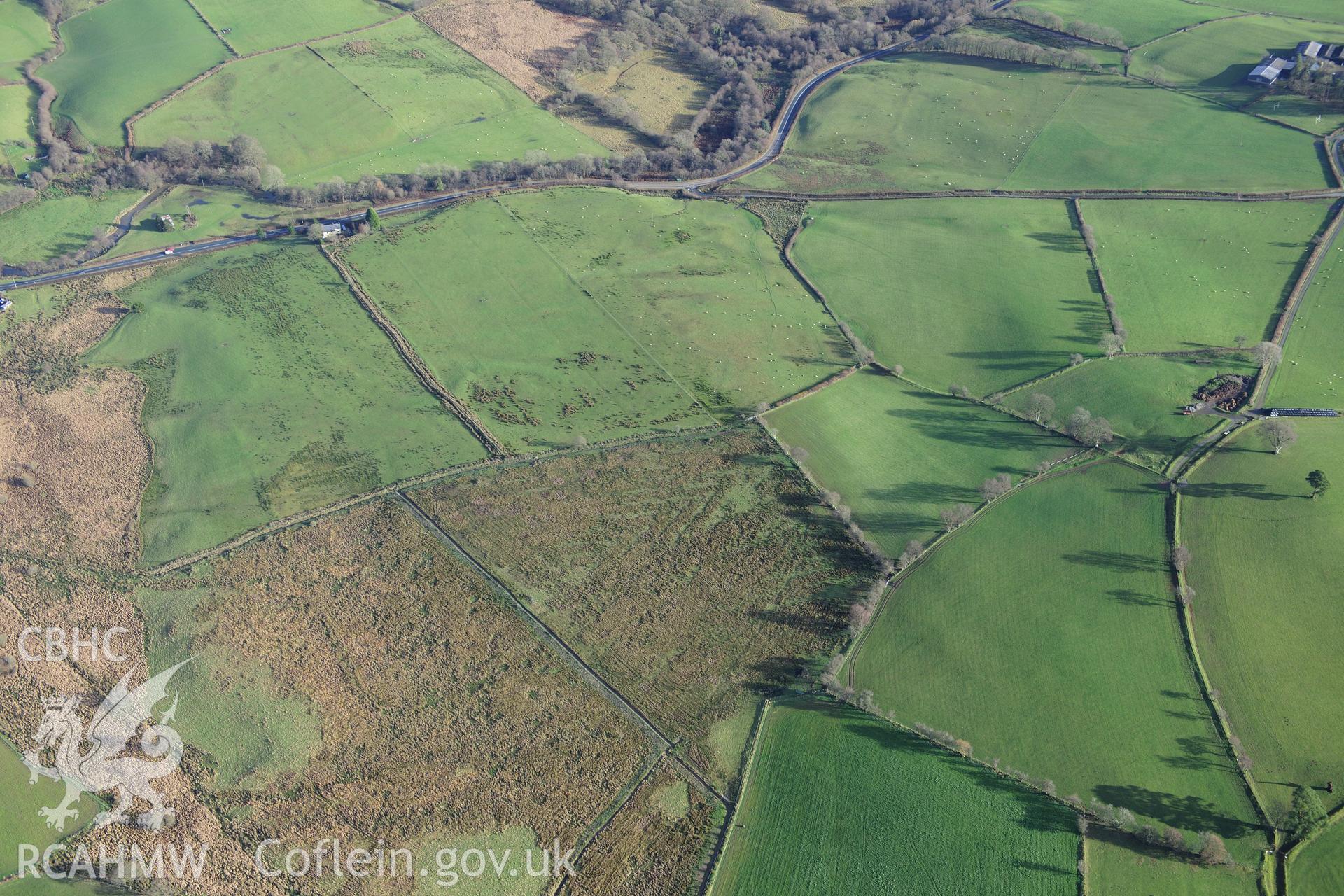 RCAHMW colour oblique photograph of Roman camps north of Caerau, Beulah (site of). Taken by Toby Driver on 23/11/2012.