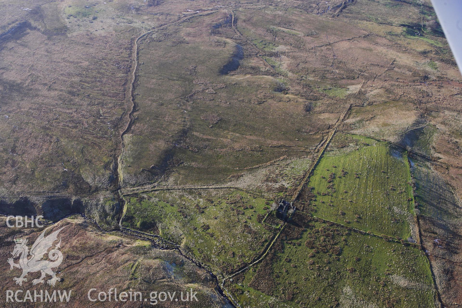 RCAHMW colour oblique photograph of Gwar Ffynnon, Deserted Famsteads. Taken by Toby Driver on 07/02/2012.