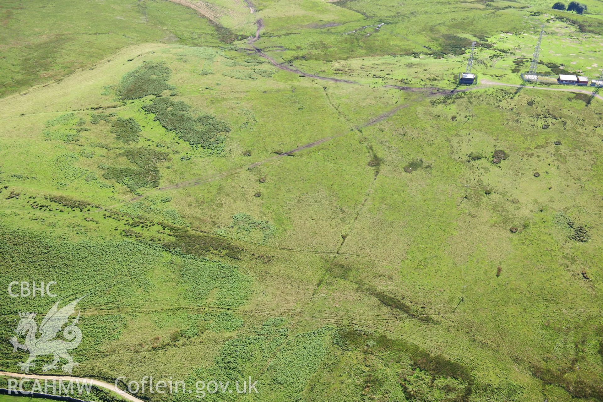 RCAHMW colour oblique photograph of Cross Ridge Dyke and Cairn on Tywn Hywel. Taken by Toby Driver on 24/07/2012.