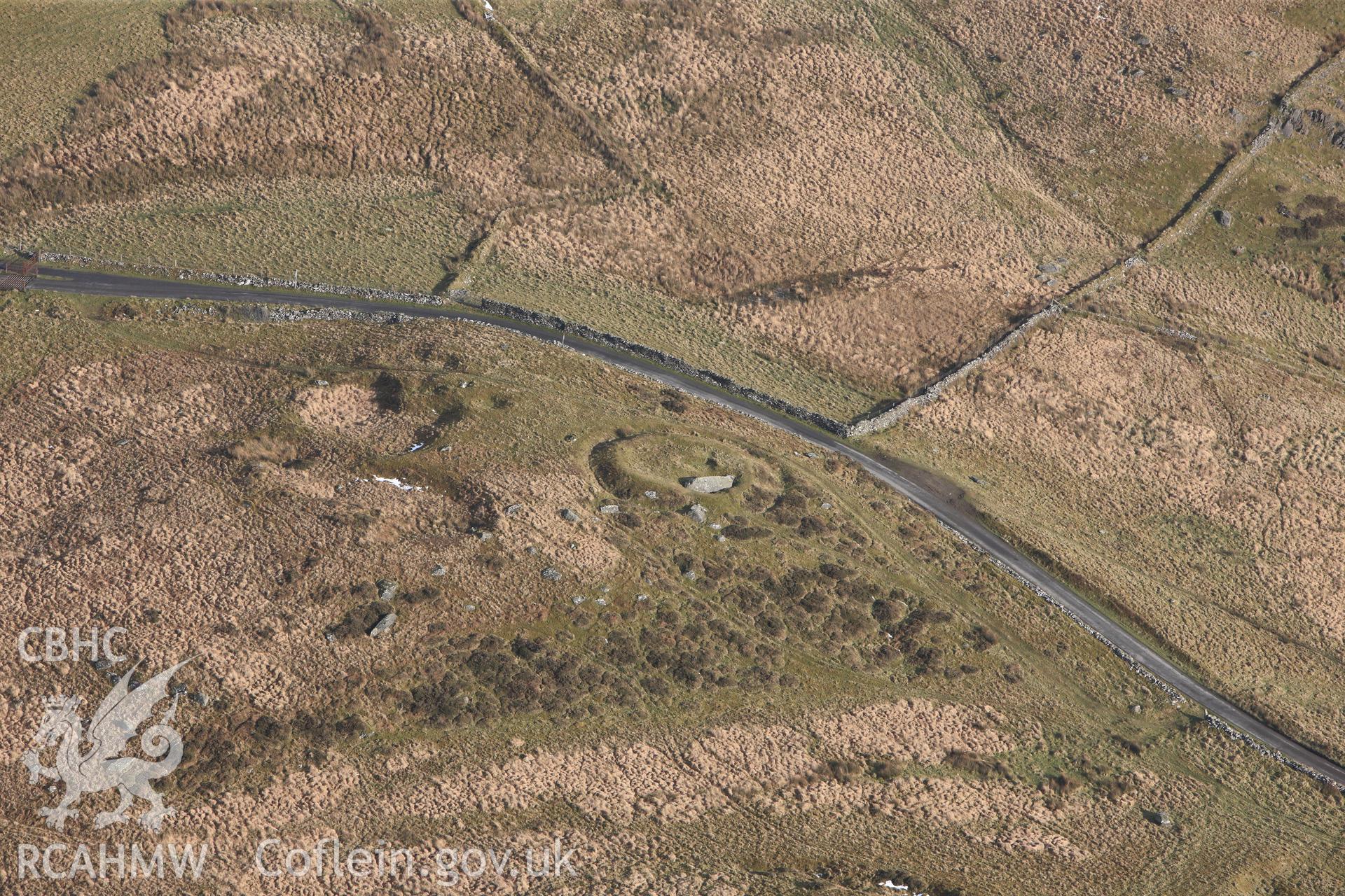 RCAHMW colour oblique photograph of Carreg-Y-Bwci Round Barrow and Roman Signal Station. Taken by Toby Driver on 07/02/2012.