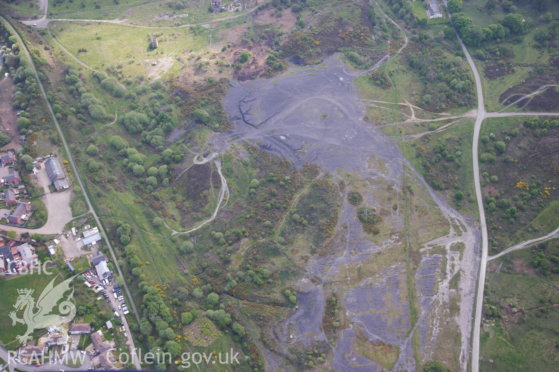 RCAHMW colour oblique photograph of British Ironworks, view from north with spoil tips. Taken by Toby Driver on 22/05/2012.