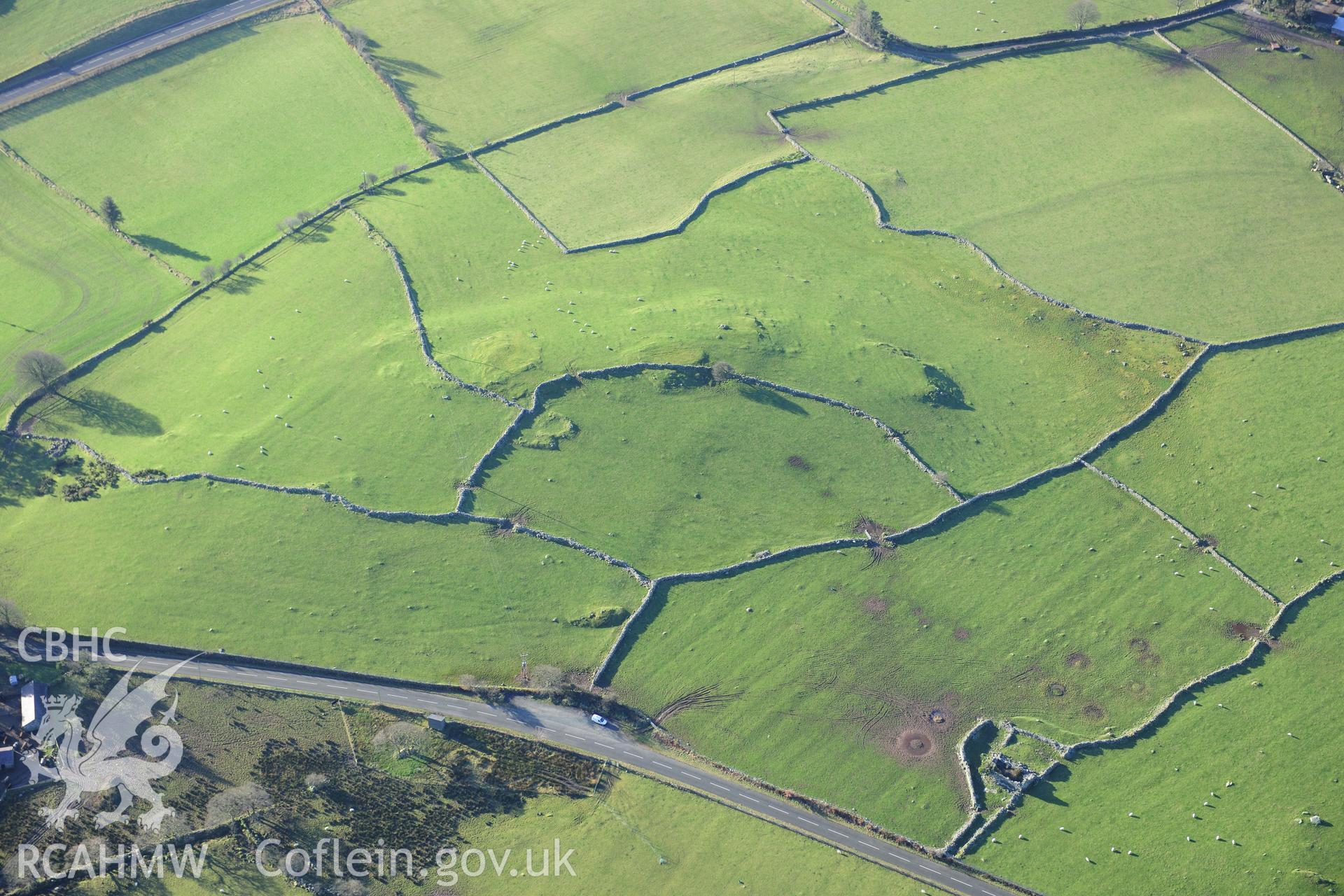 RCAHMW colour oblique photograph of Ty-Newydd, enclosed hut group. Taken by Toby Driver on 10/12/2012.