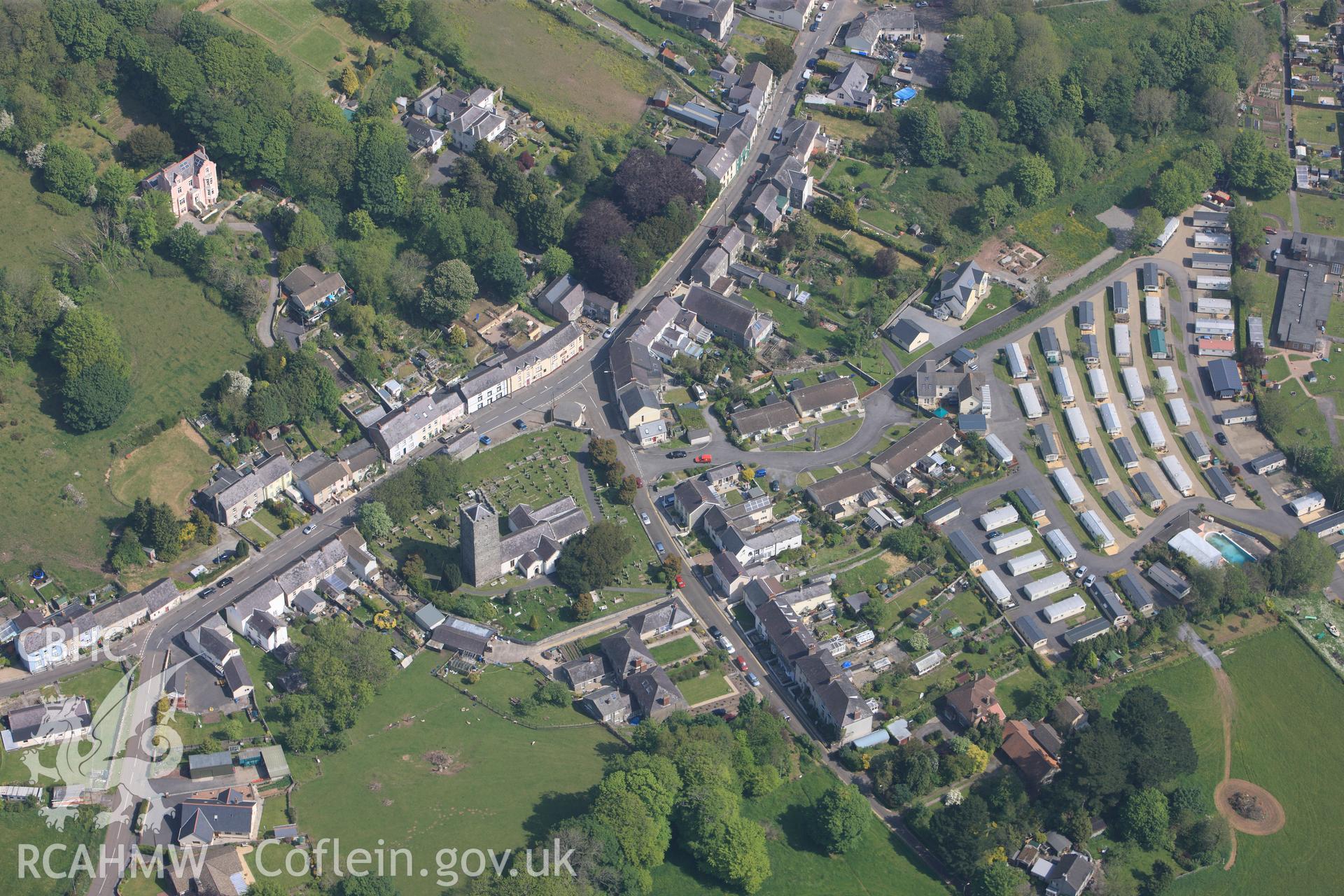 RCAHMW colour oblique photograph of General view of Llanstephan including St Stephen's Church, looking north east. Taken by Toby Driver on 24/05/2012.