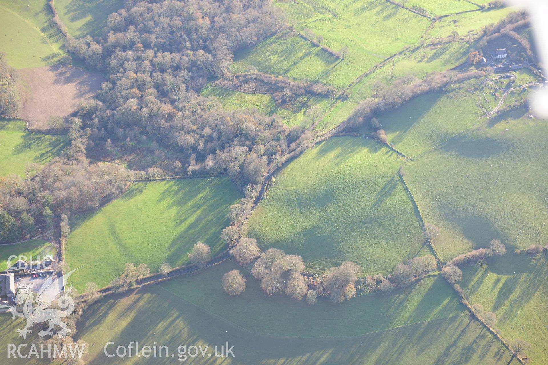 RCAHMW colour oblique photograph of Grongaer hillfort, earthworks to north-east of. Taken by Toby Driver on 28/11/2012.