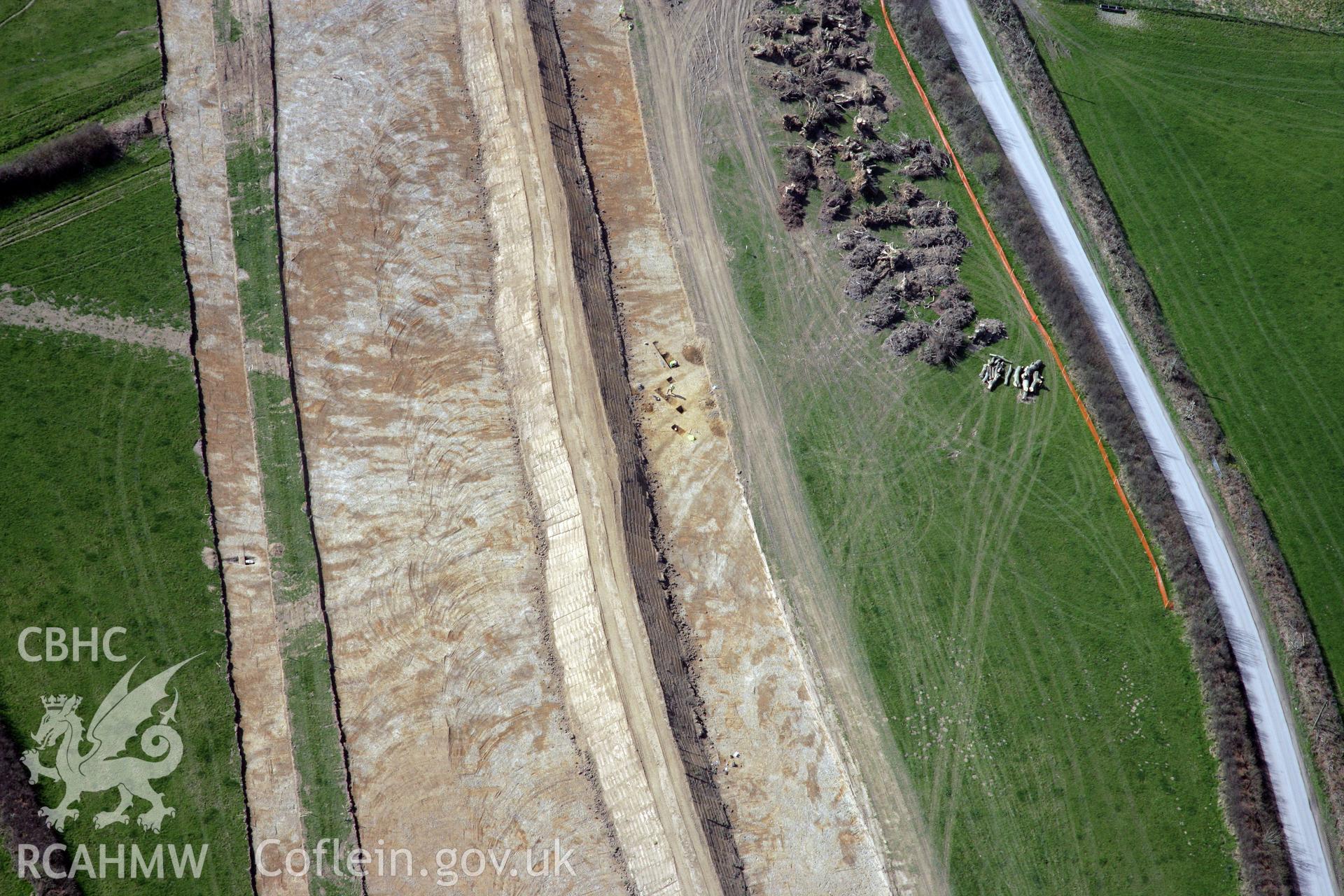 RCAHMW colour oblique photograph of A477 Bypass, at Pentrehowell. Archaeological excavations in progress. Taken by Toby Driver and Oliver Davies on 28/03/2012.