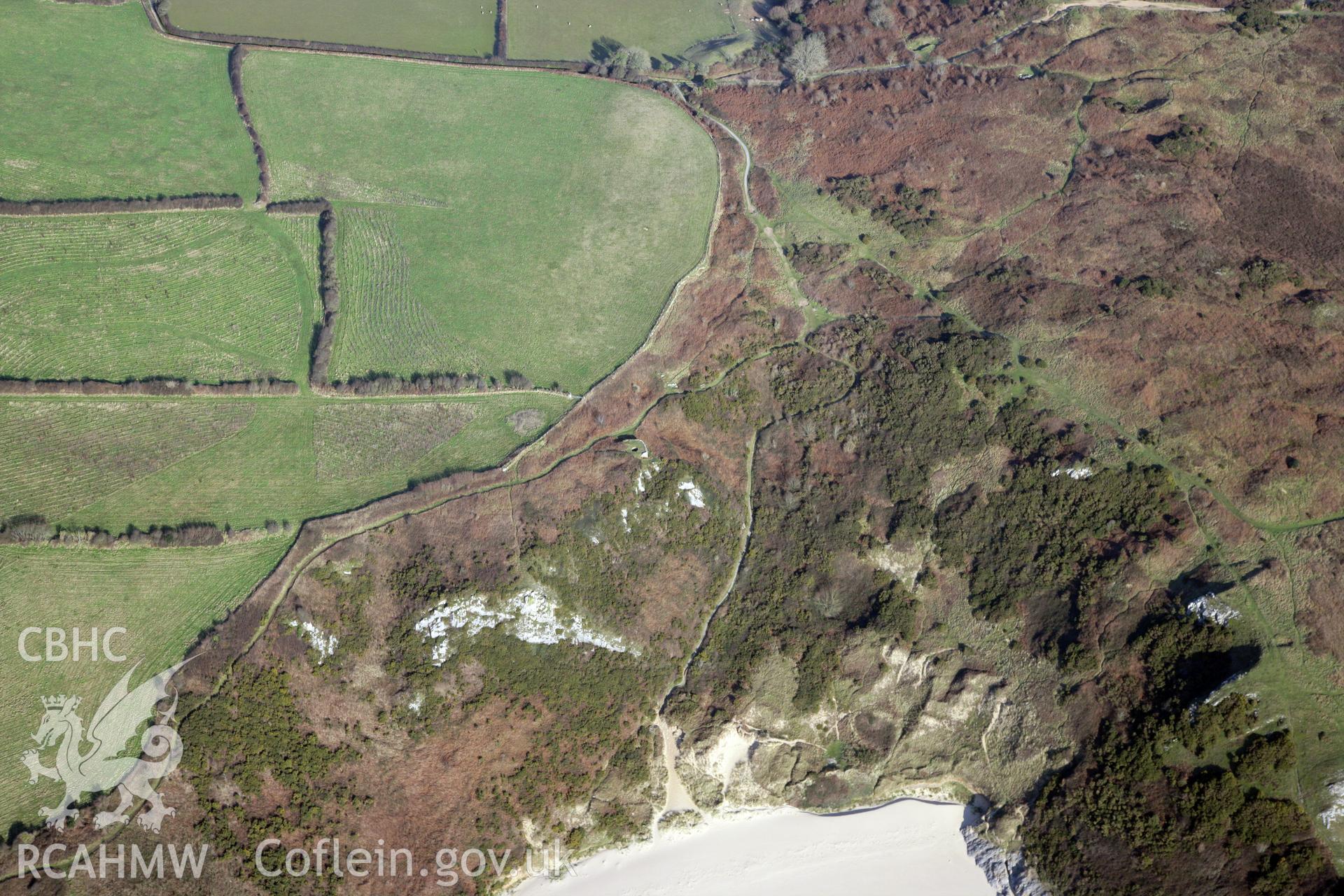 RCAHMW colour oblique photograph of Penmaen Burrows Burial Chamber. Taken by Toby Driver on 02/02/2012.