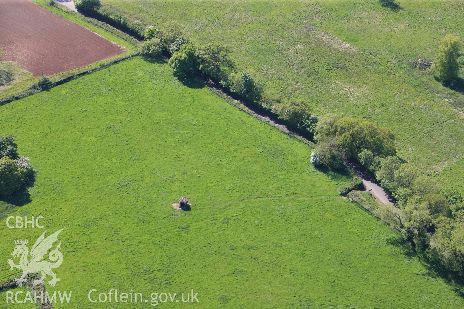 RCAHMW colour oblique photograph of St Lythans chambered long cairn, viewed from the south-east. Landscape view. Taken by Toby Driver on 22/05/2012.