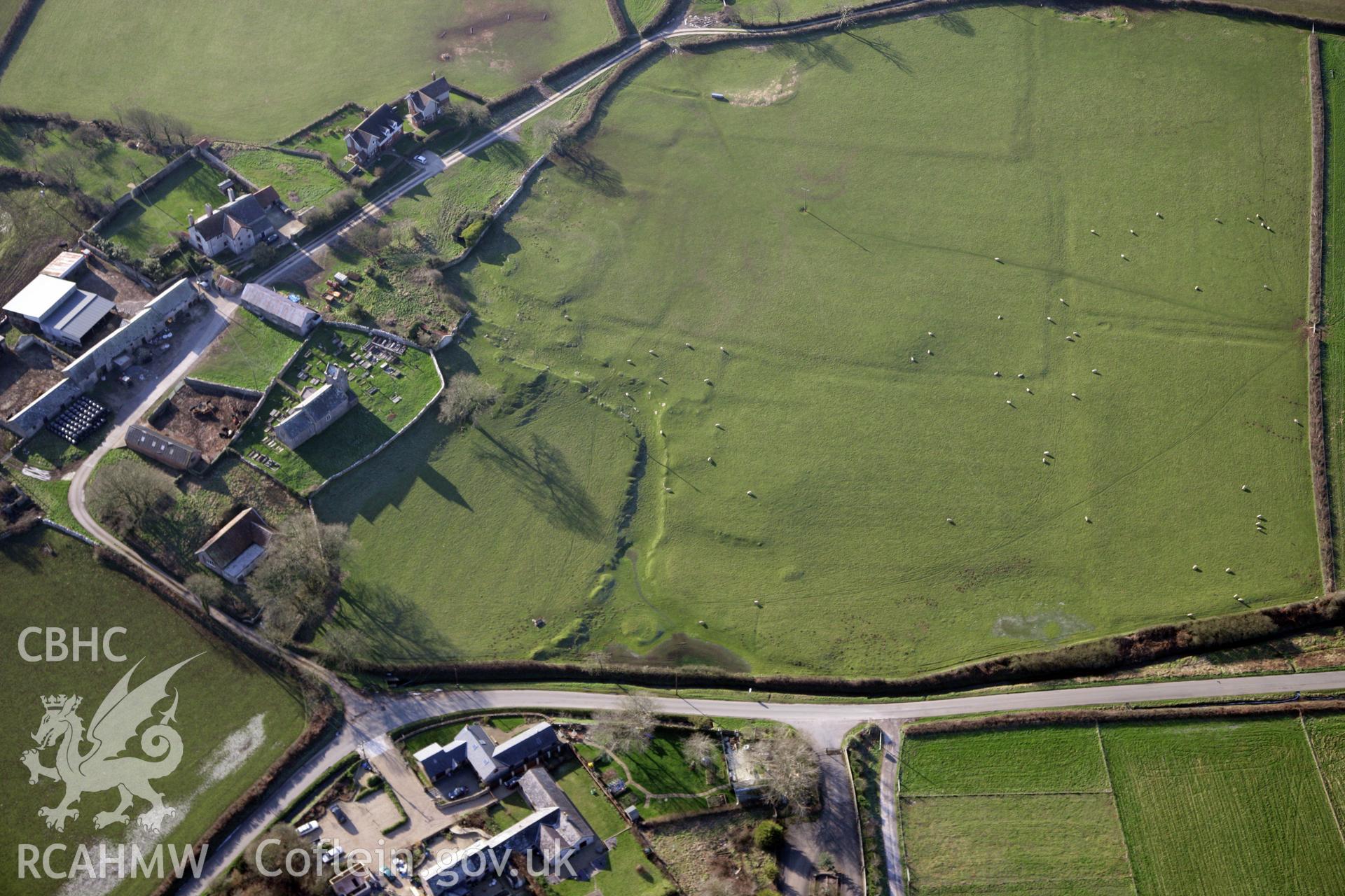 RCAHMW colour oblique photograph of Llanddewi Earthworks. Taken by Toby Driver on 02/02/2012.