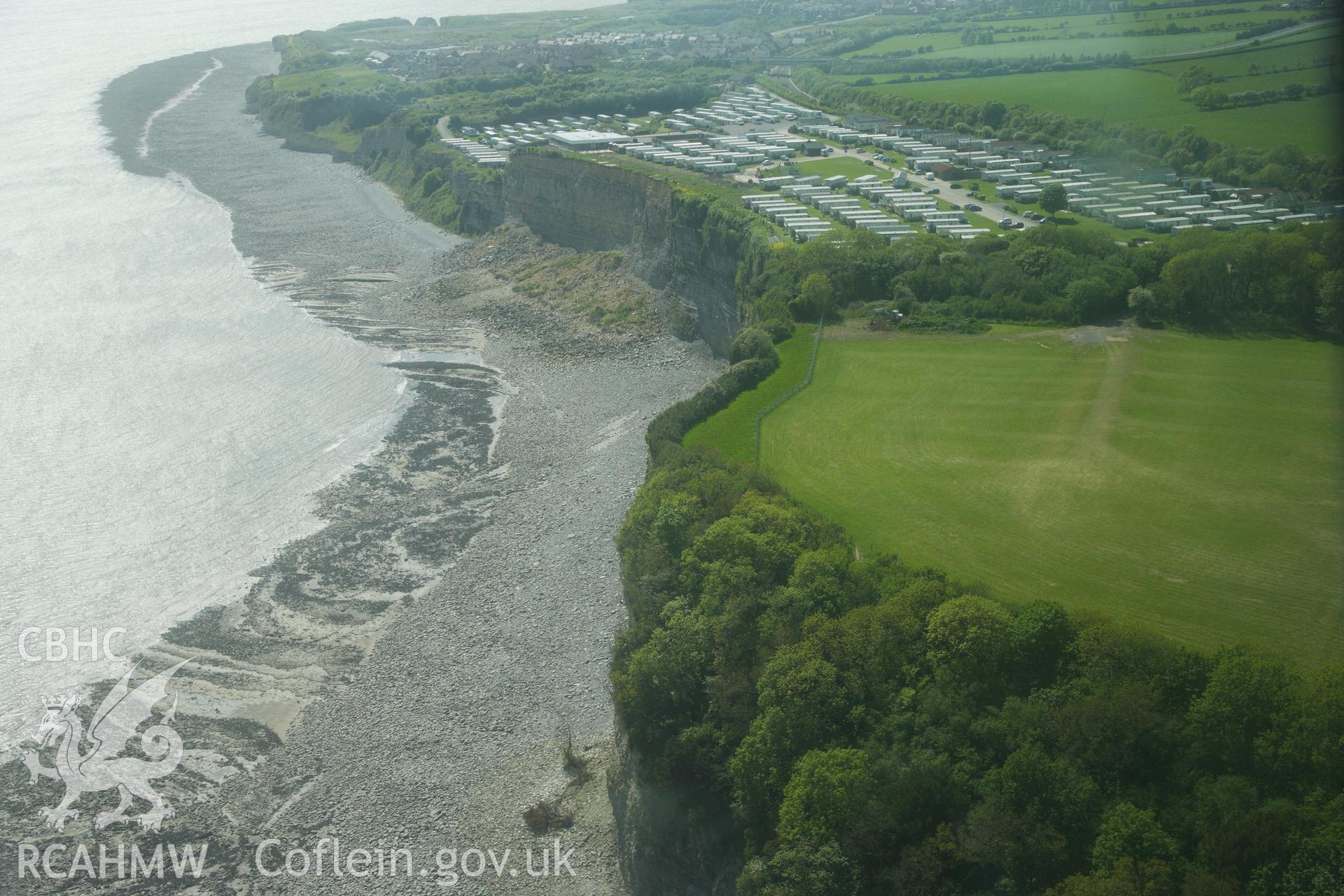 RCAHMW colour oblique photograph of The Bulwarks Camp, with recent cliff collapse at Porthkerry Caravan Park. Taken by Toby Driver on 22/05/2012.