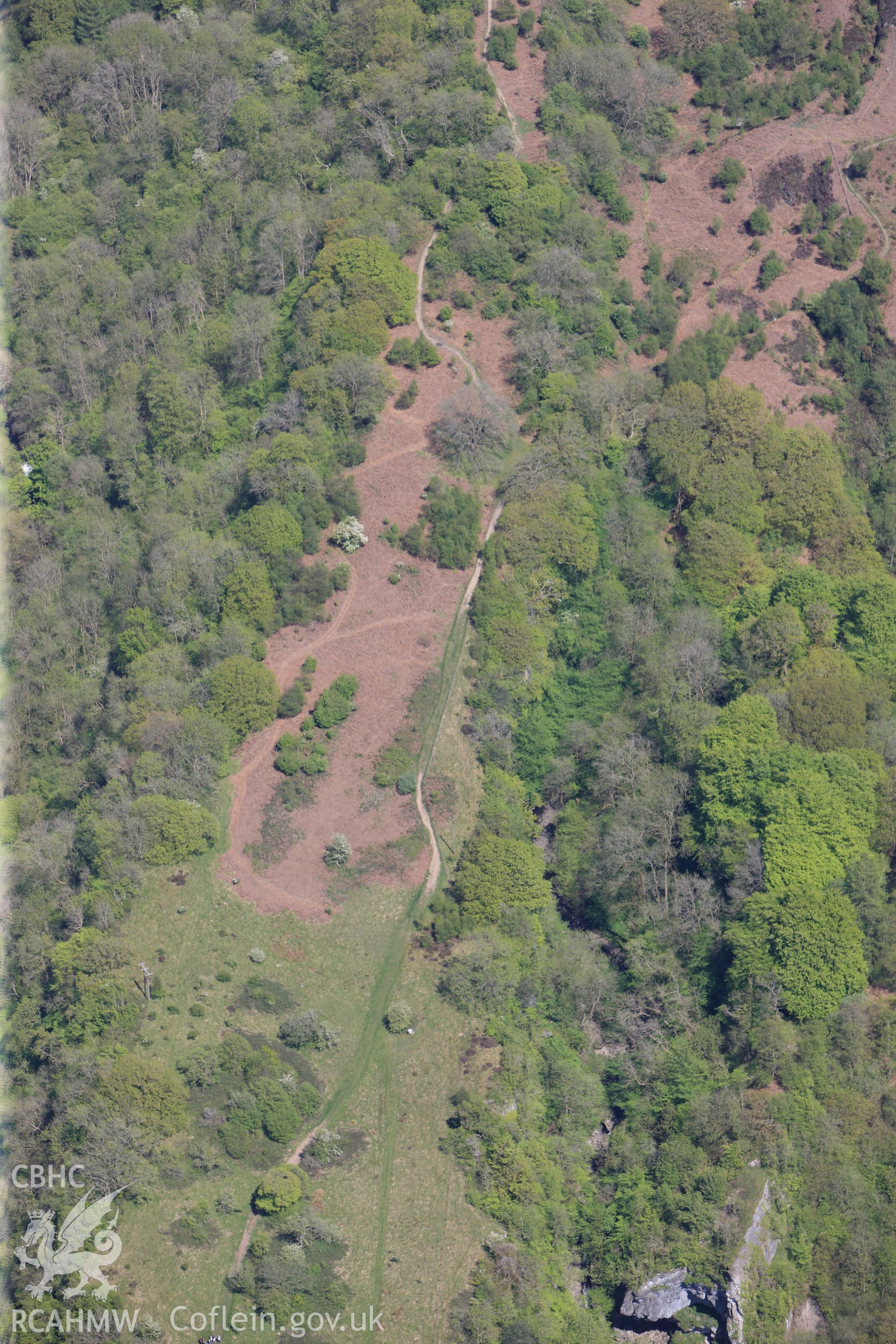 RCAHMW colour oblique photograph of Craig y Ddinas promontory fort, and Black Powder works, from west. Taken by Toby Driver on 22/05/2012.