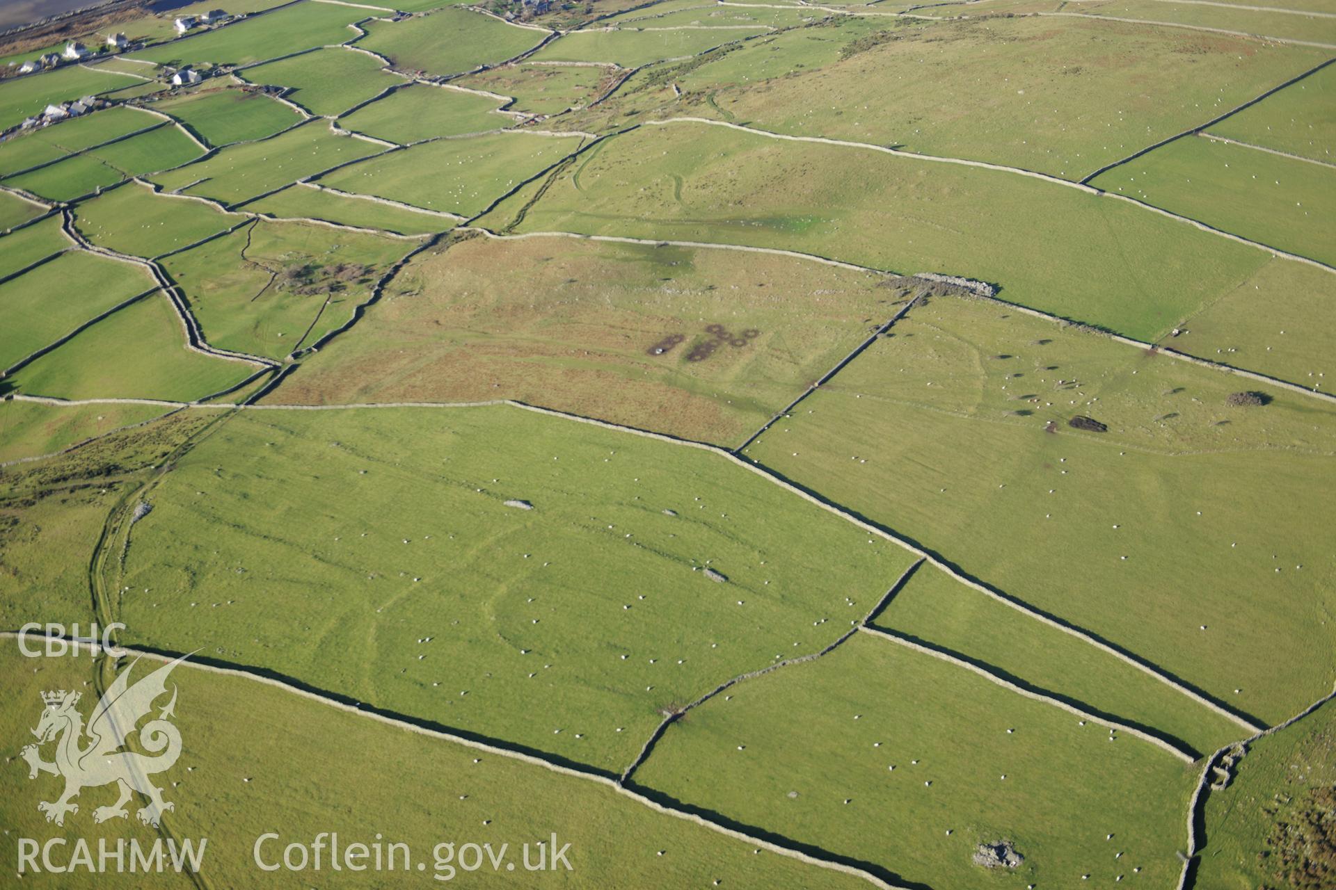 RCAHMW colour oblique photograph of Hendre Coed Uchaf concentric enclosures. Taken by Toby Driver on 10/12/2012.