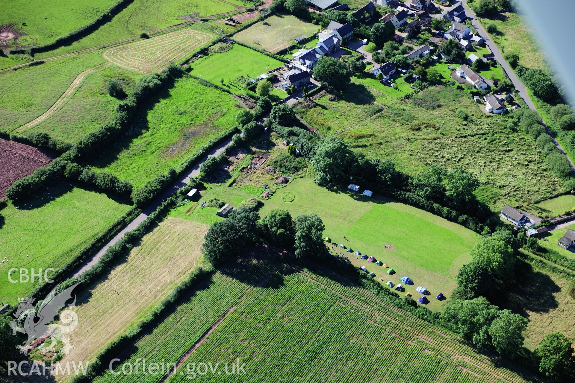 RCAHMW colour oblique photograph of Trellech village earthworks, under excavation. Taken by Toby Driver on 24/07/2012.