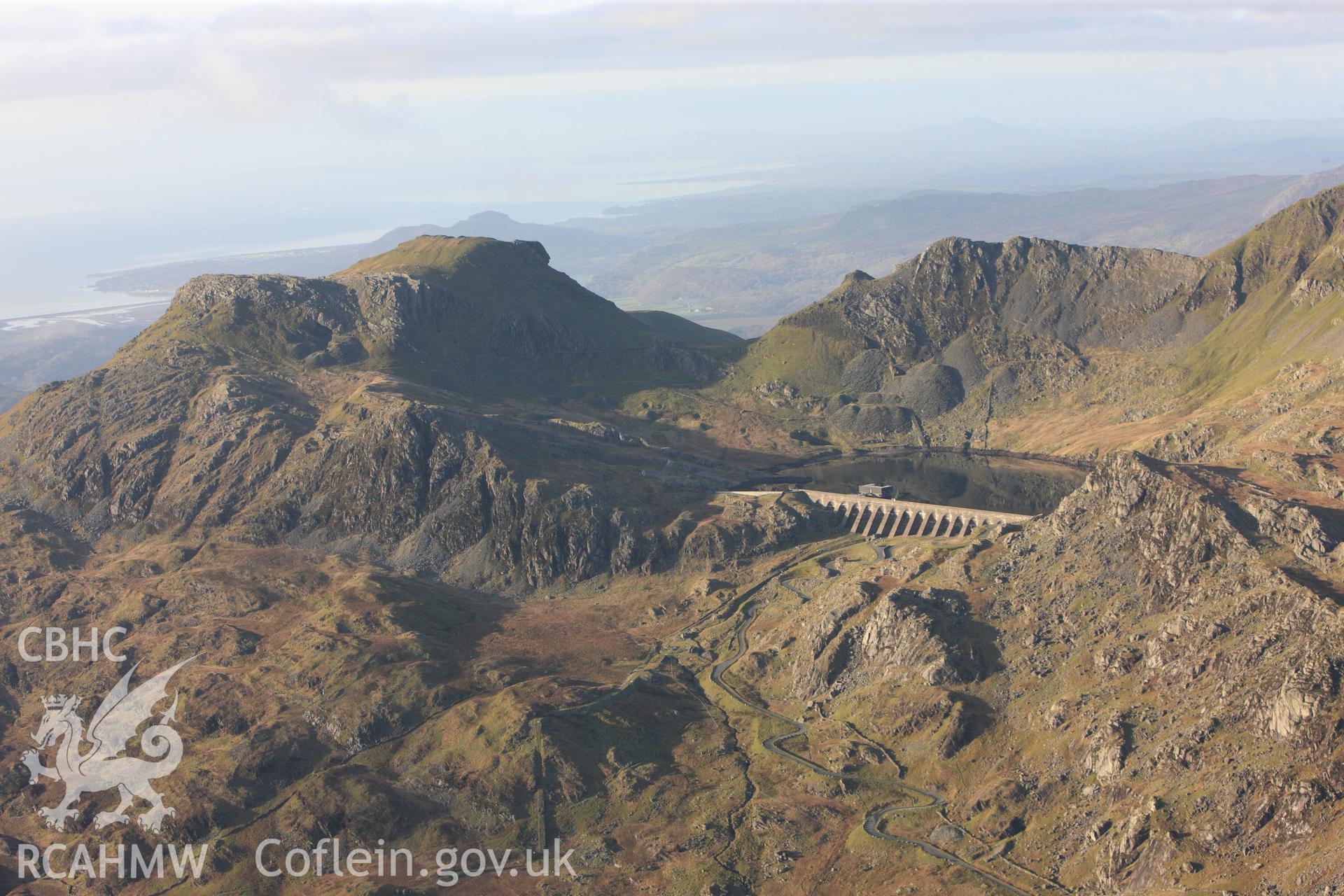 RCAHMW colour oblique photograph of Llyn Stwlan reservoir, with Moelwyn slate quarry. Taken by Toby Driver on 13/01/2012.