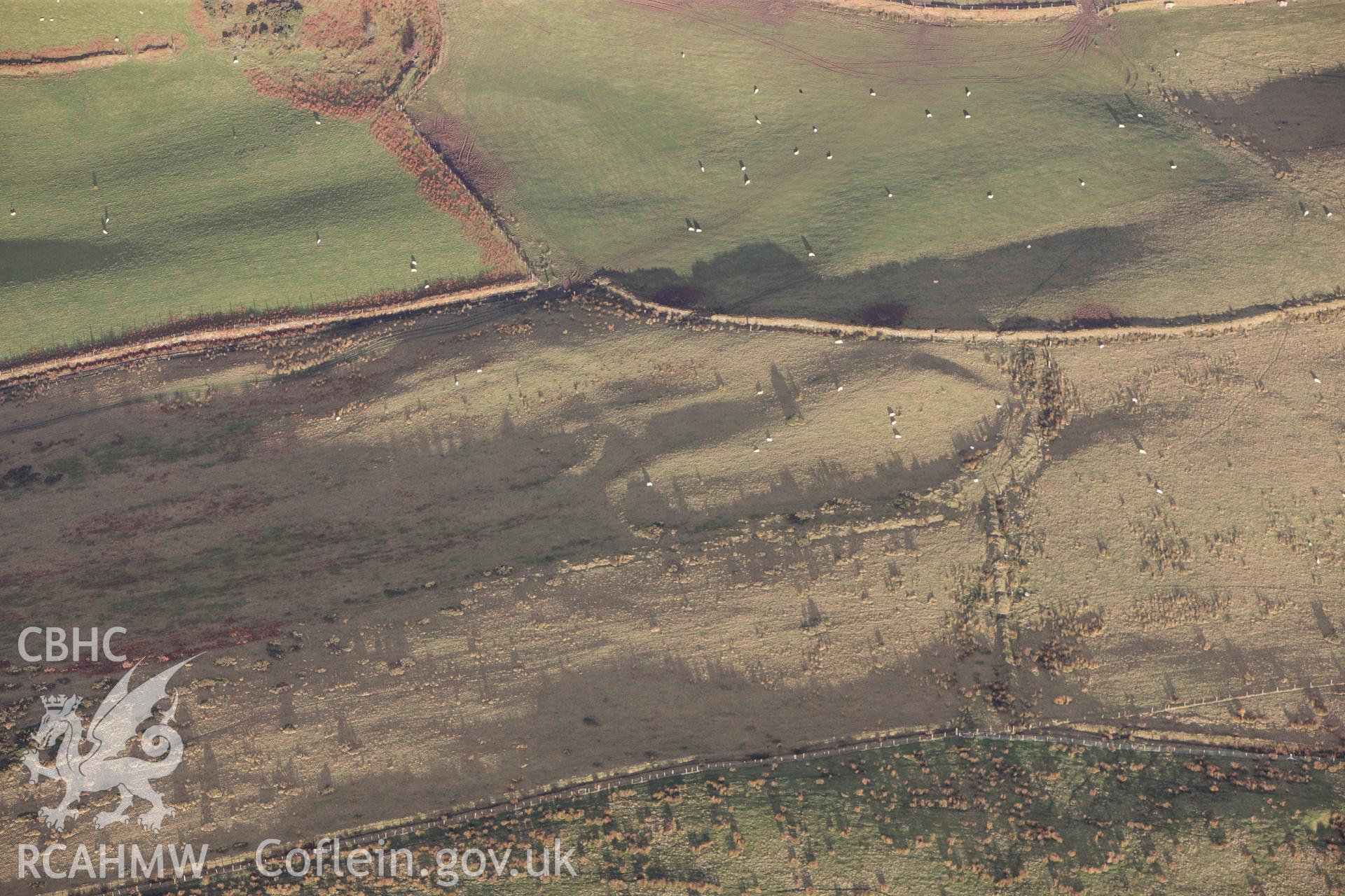 RCAHMW colour oblique photograph of Foel Fynyddau, deserted rural settlement west of scheduled remains. Taken by Toby Driver on 28/11/2012.