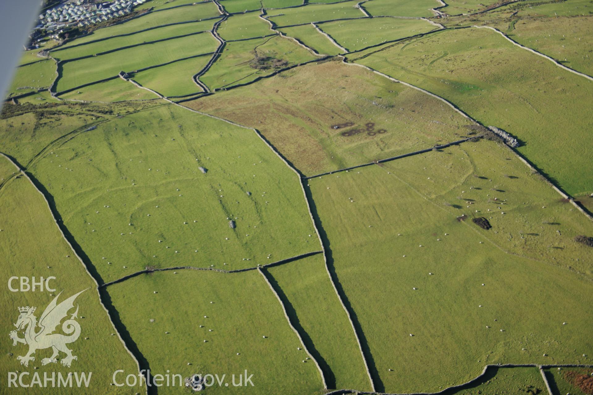 RCAHMW colour oblique photograph of Hendre Coed Uchaf concentric enclosures. Taken by Toby Driver on 10/12/2012.