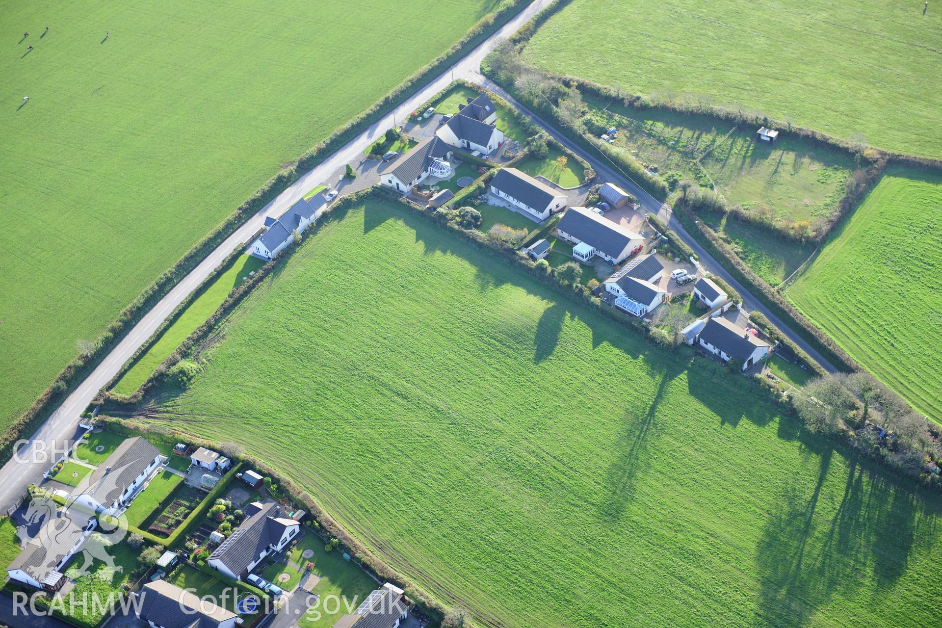 RCAHMW colour oblique photograph of Crug Swllt Round Barrow, Tavernspite. Taken by Toby Driver on 26/10/2012.