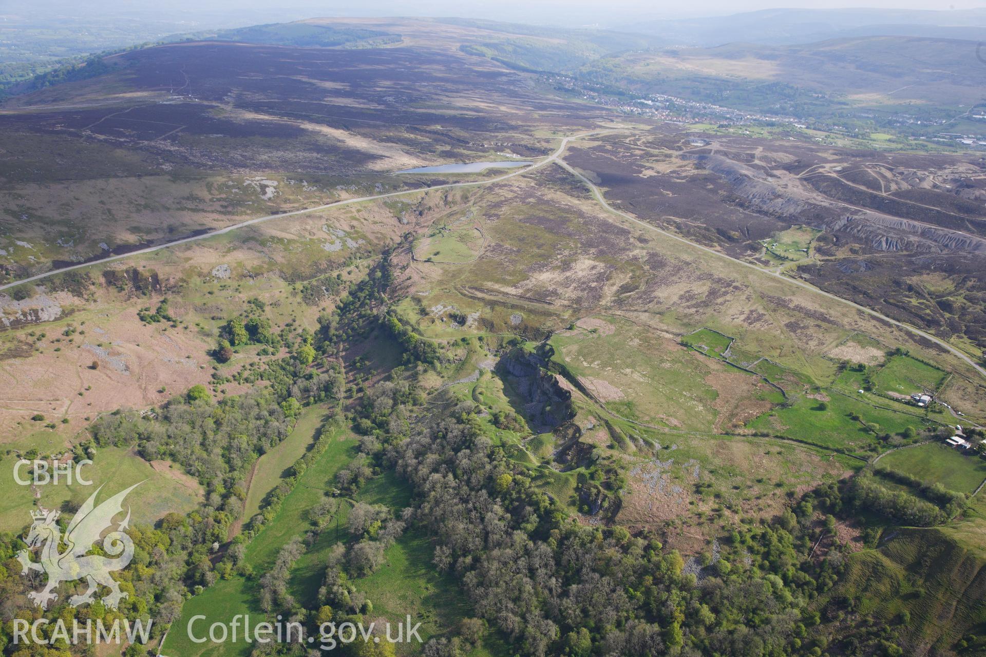 RCAHMW colour oblique photograph of Pwll Du Limestone Quarry, and wider landscape. Taken by Toby Driver on 22/05/2012.