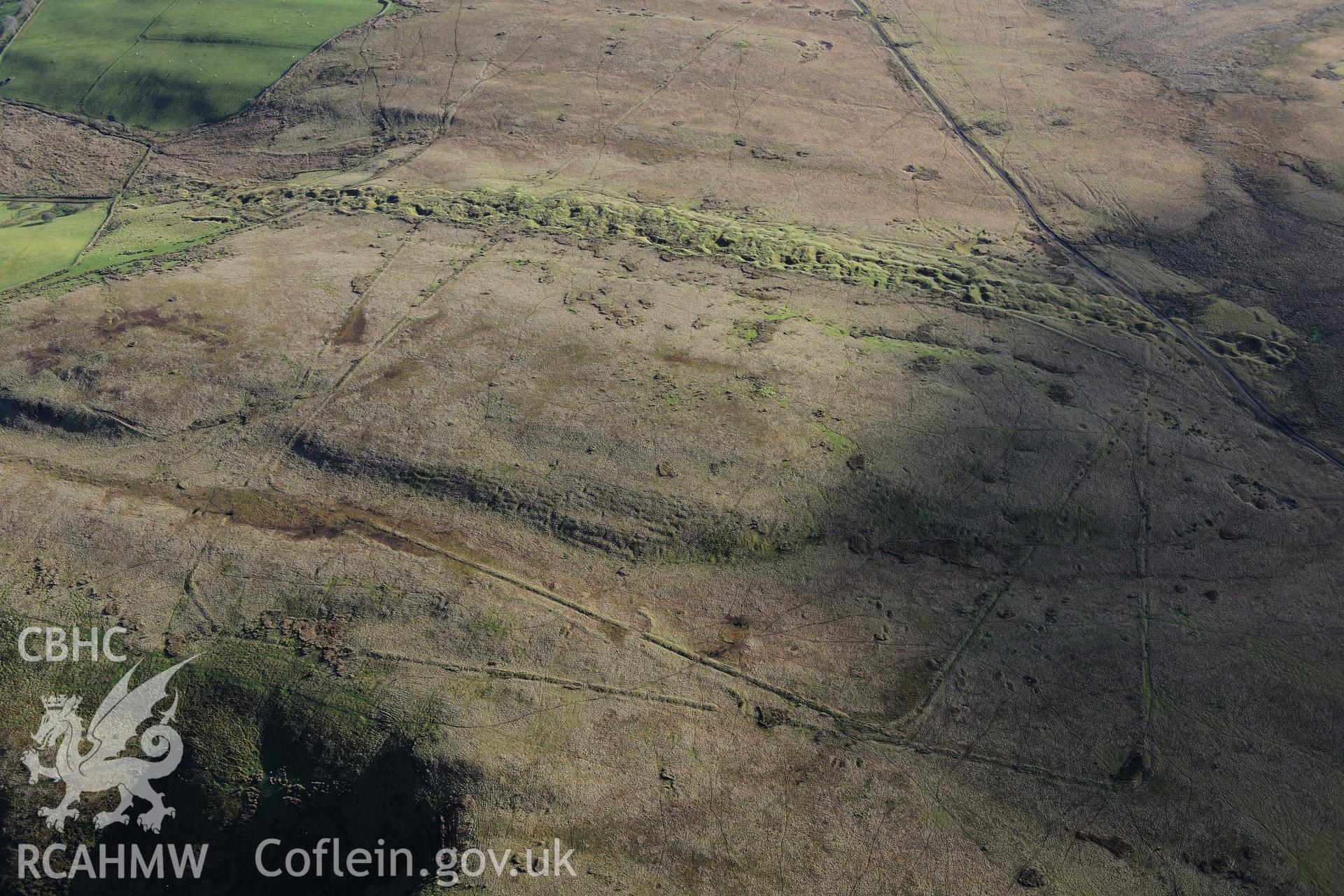 RCAHMW colour oblique photograph of Y Pigwn Roman camps. Taken by Toby Driver on 23/11/2012.