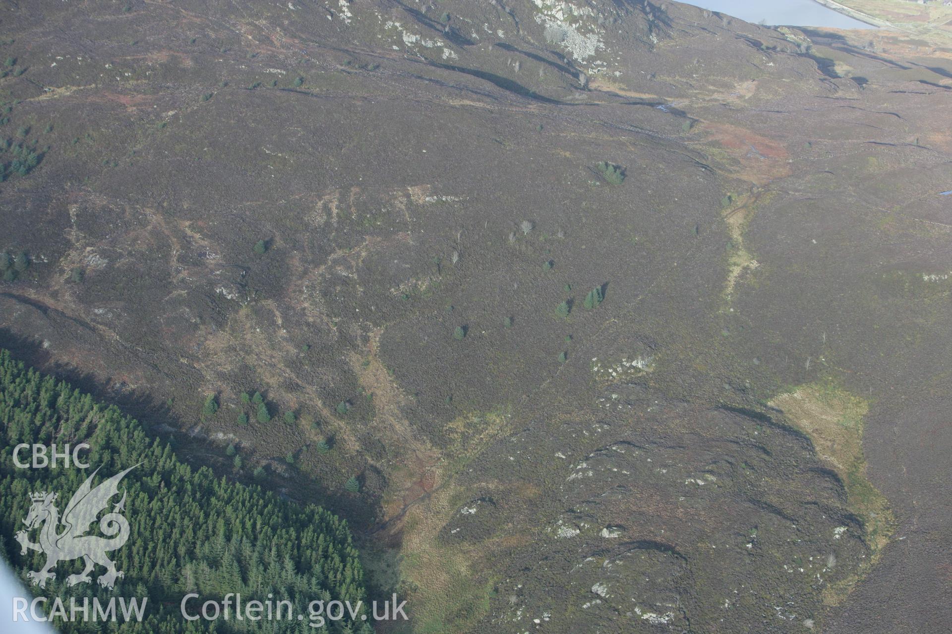 RCAHMW colour oblique photograph of Hut settlement west of Allt Goch. Taken by Toby Driver on 13/01/2012.