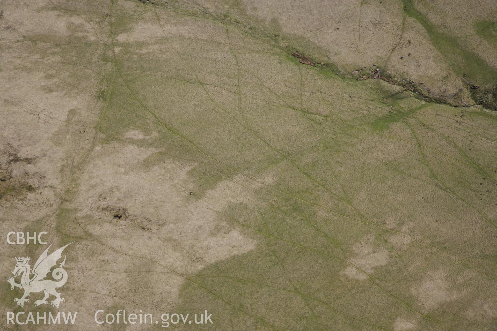 RCAHMW colour oblique photograph of Bannau sir gaer stone circle, possible missed target. Taken by Toby Driver on 22/05/2012.