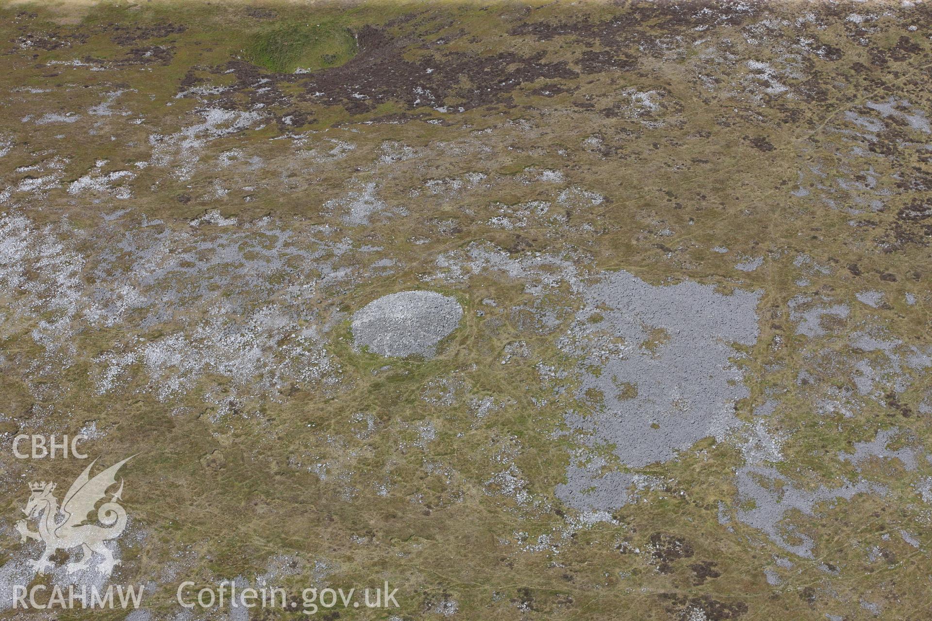 RCAHMW colour oblique photograph of Tair Carn Uchaf, cairn B, detailed view. Taken by Toby Driver on 22/05/2012.