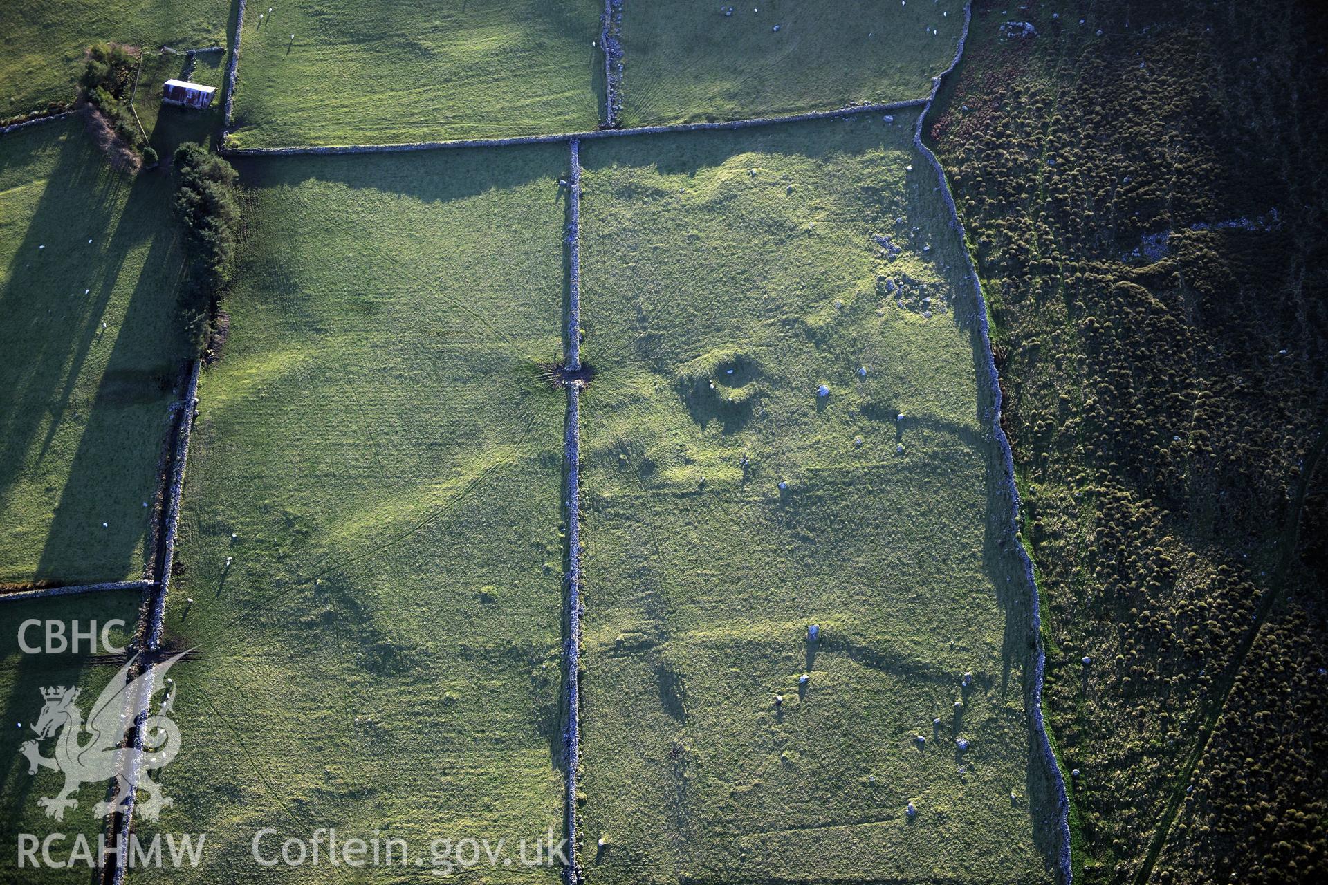 RCAHMW colour oblique photograph of Tyddyn mawr settlement and field system. Taken by Toby Driver on 10/12/2012.